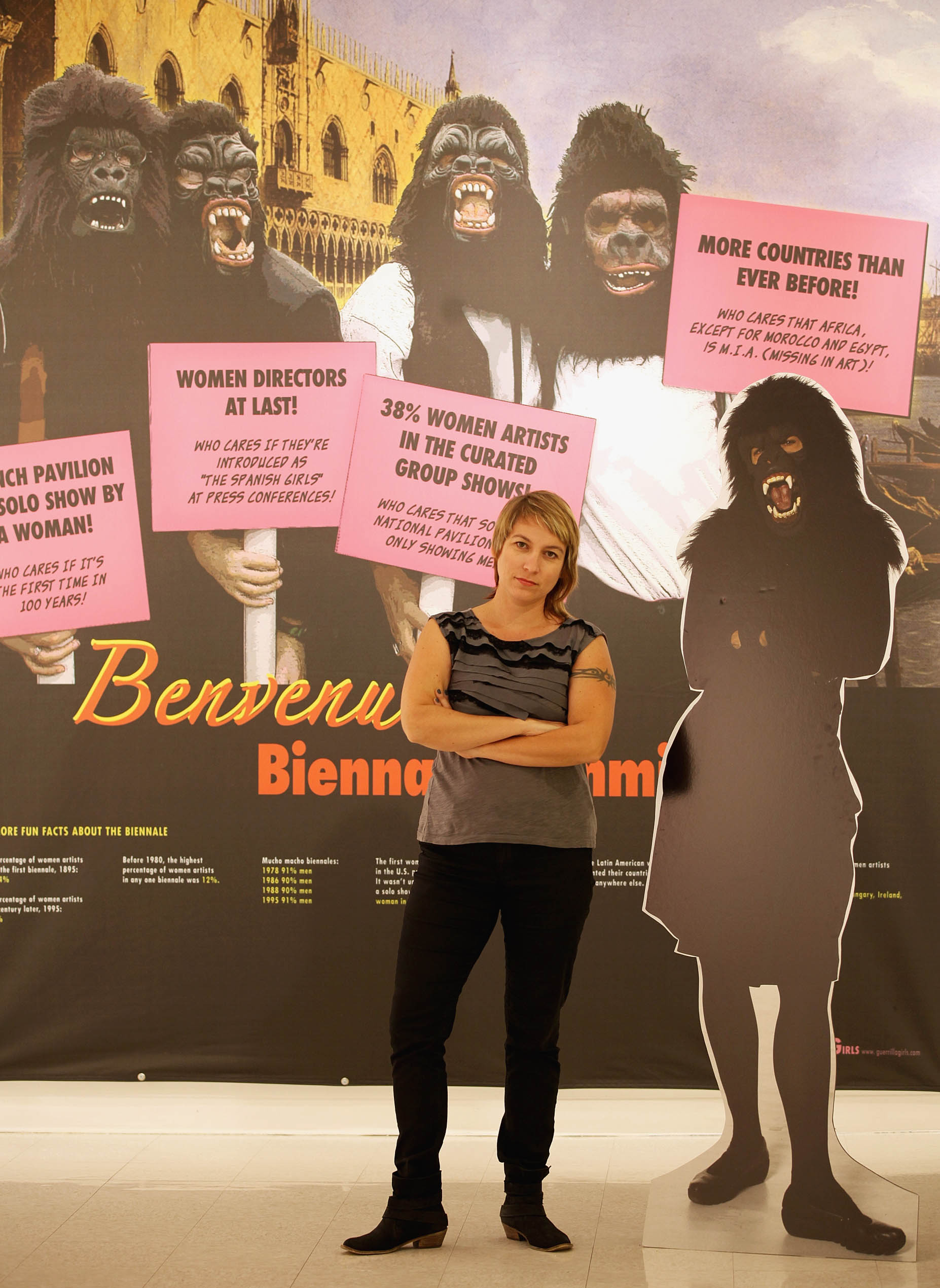 Above: Montserrat’s Leonie Bradbury with Guerrilla Girls signage.
