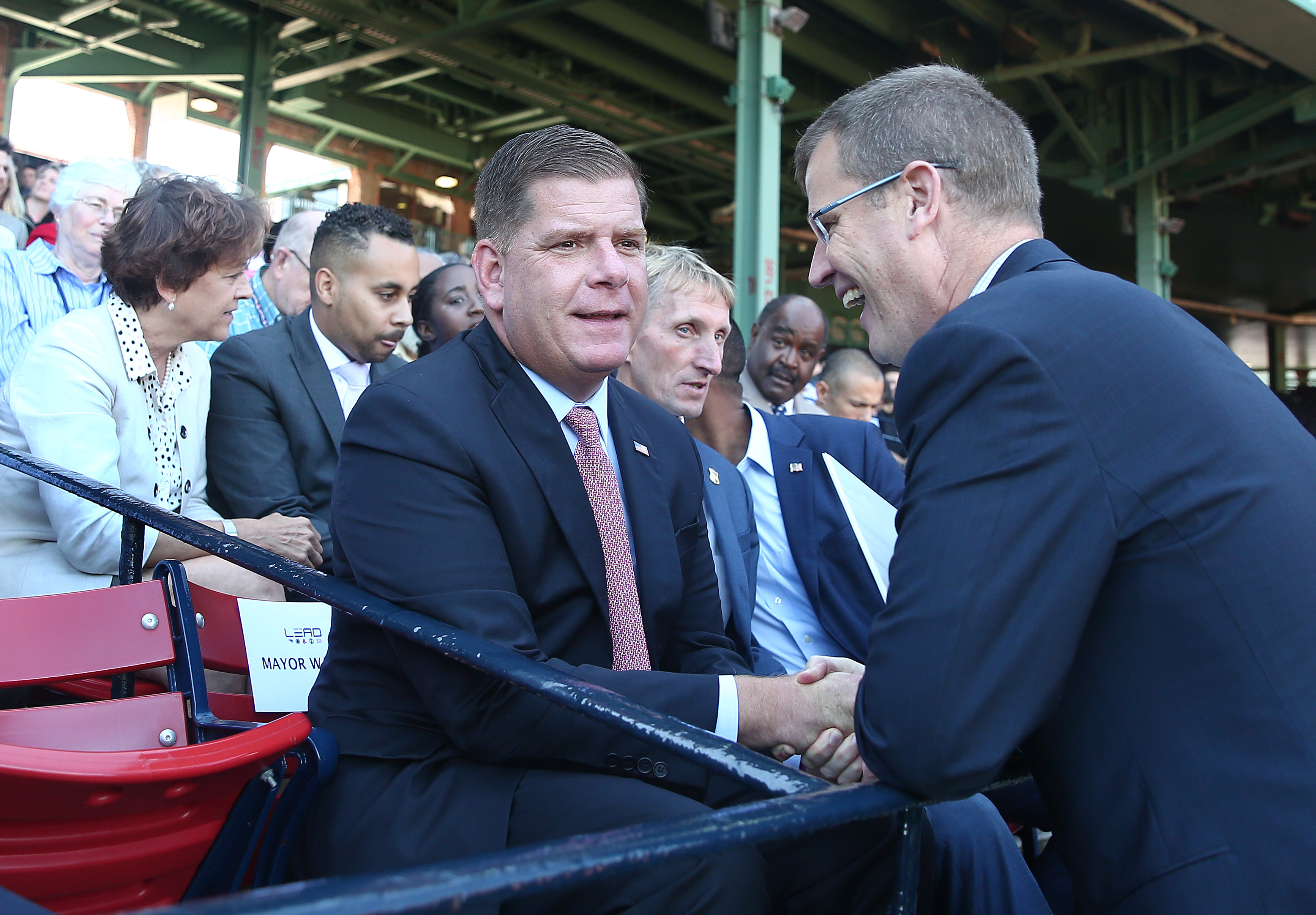 Mayor Martin J. Walsh is greeted by Red Sox CEO and president Sam Kennedy.