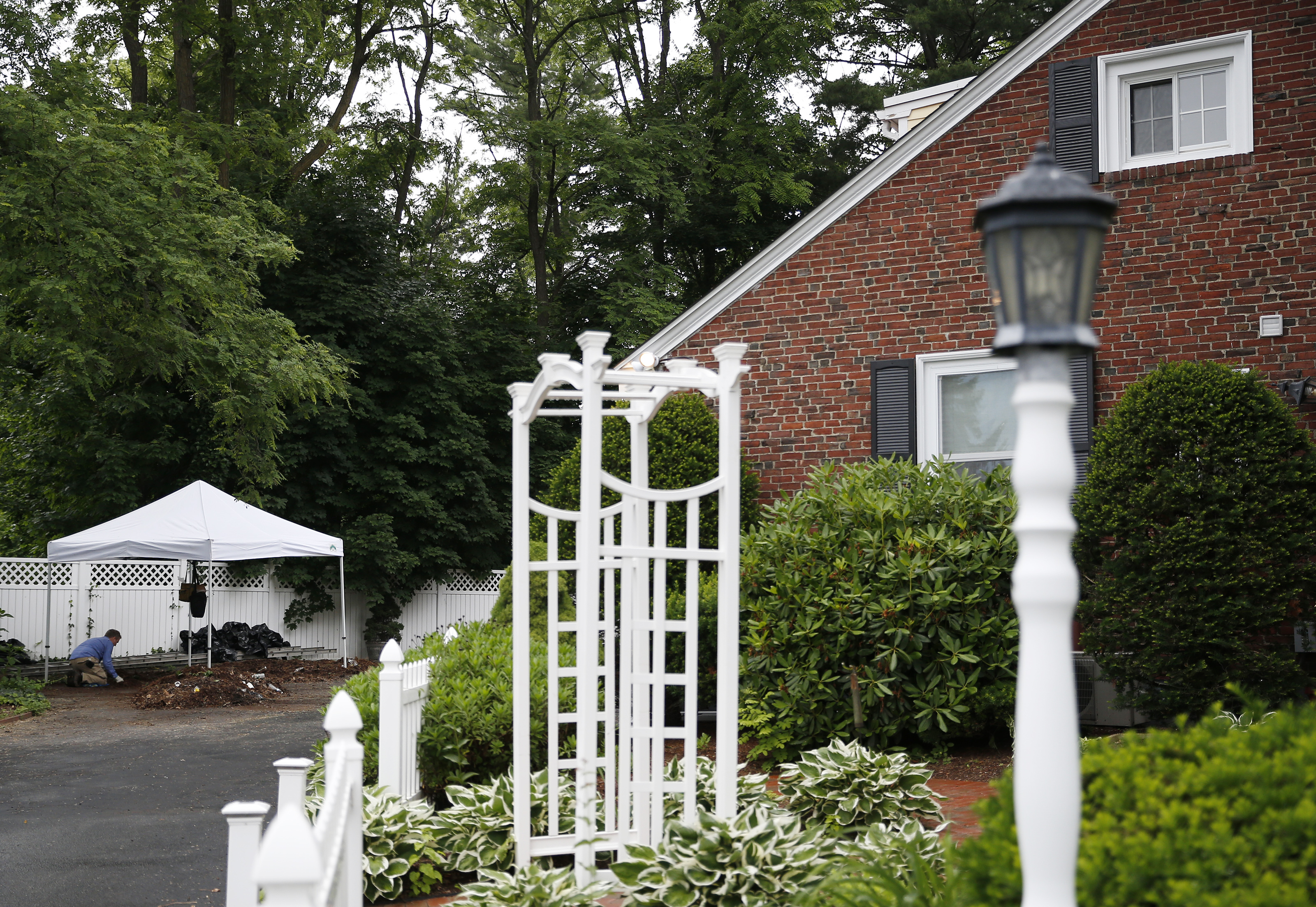 An investigator searched for clues outside the Wakefield home.