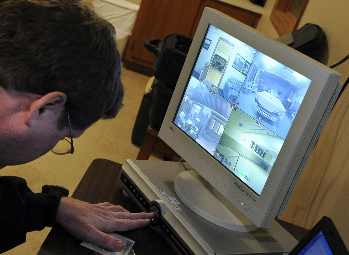 Jim Stonier sets up computer equipment.
