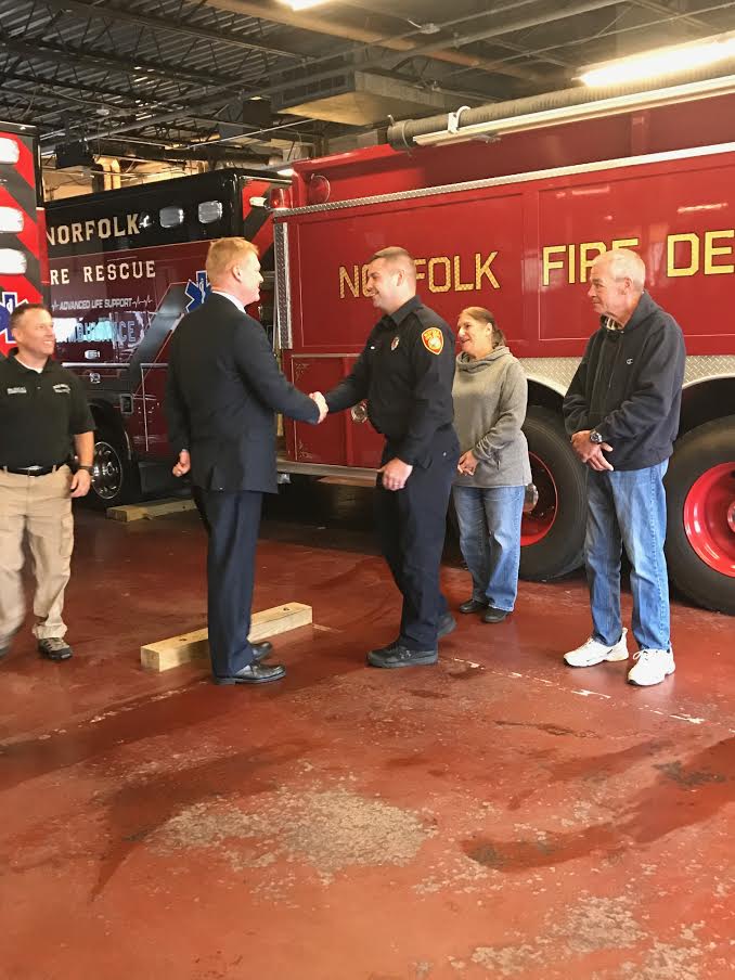 Ben Podsiadlo, left, shakes hands with Kevin Brady, whose life he helped saved in 1993.