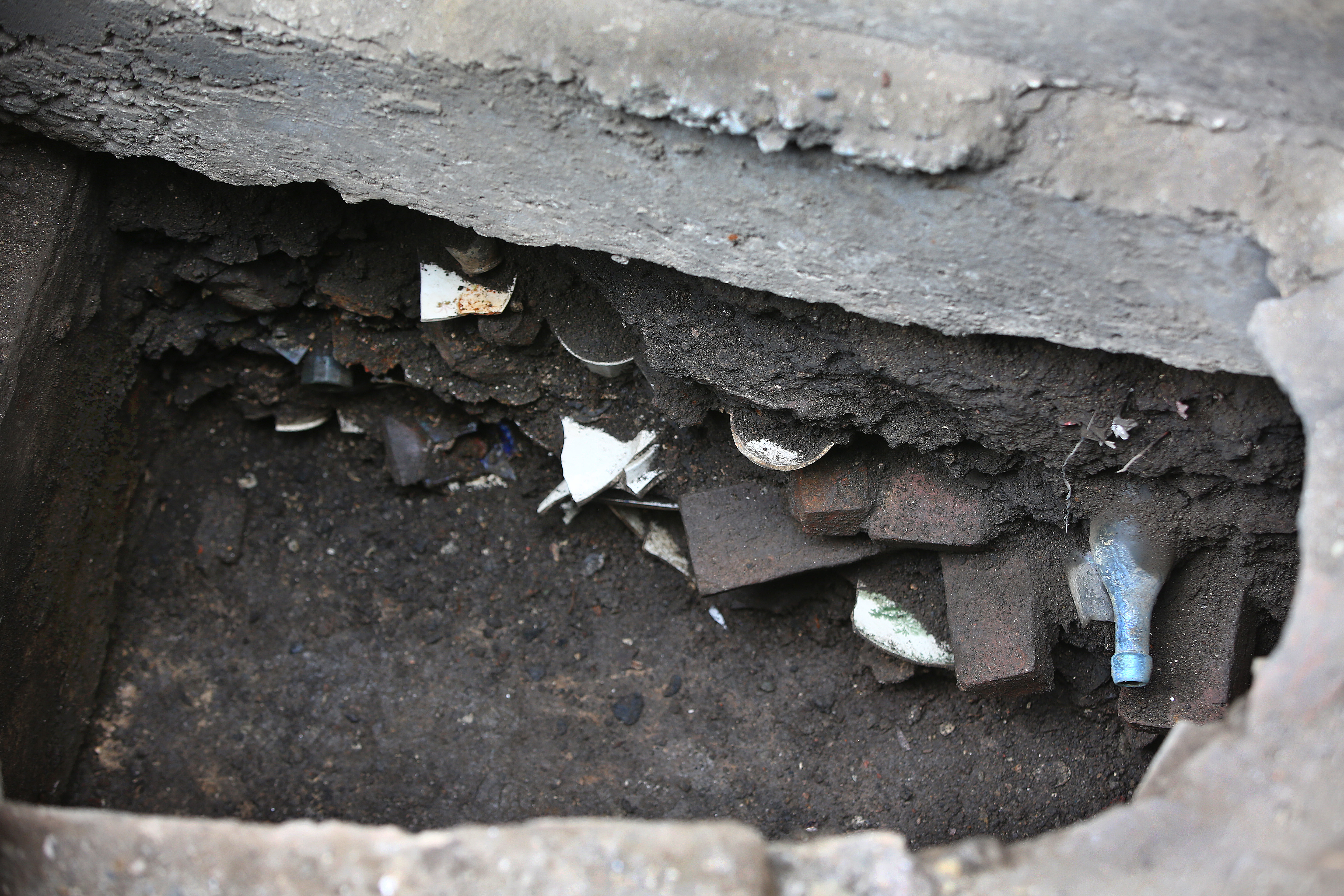The earthenware in this part of the privy will remain under the foundation wall.