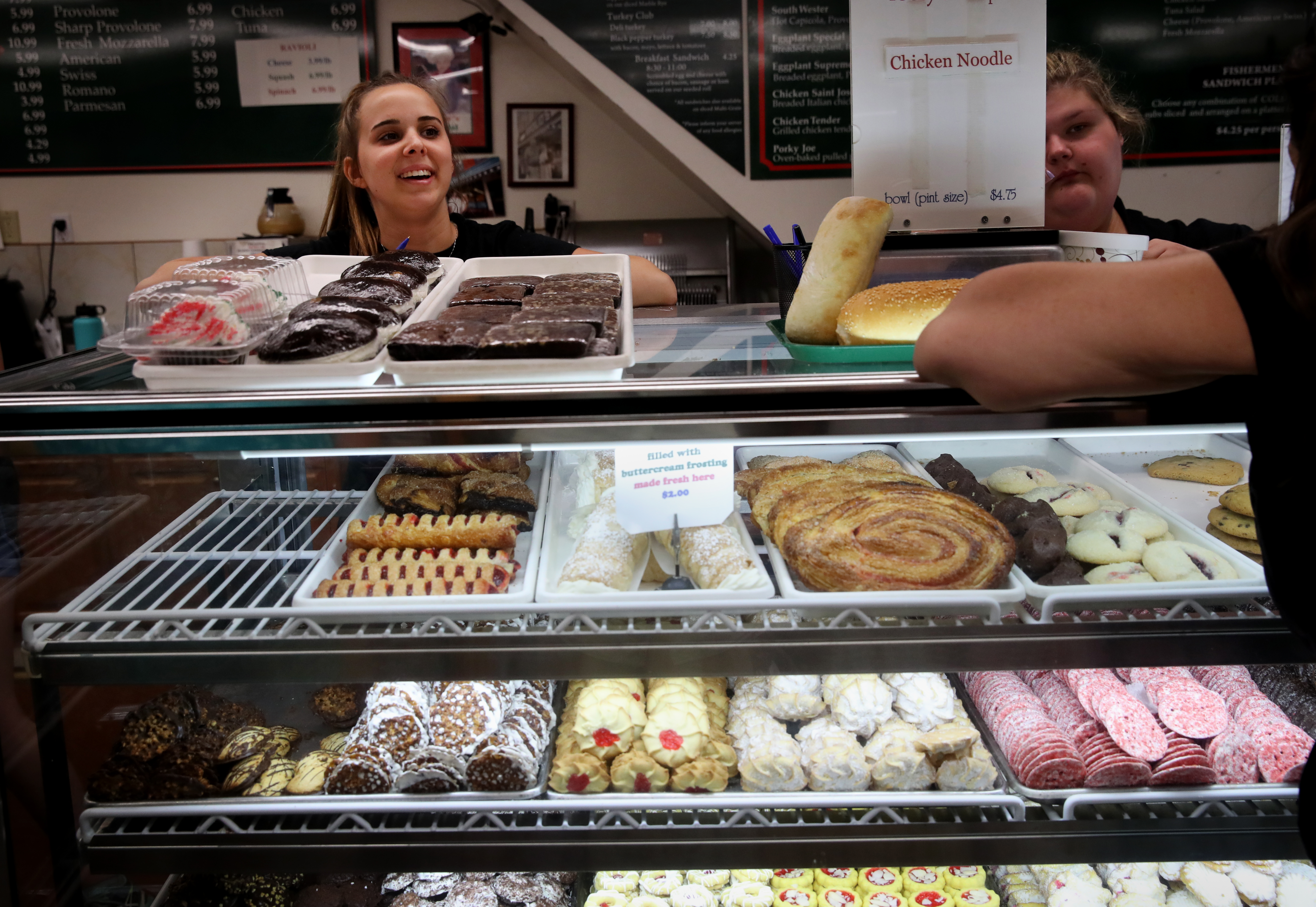 Sophia Pata works behind the counter at Virgilio's Italian Bakery on Main Street.