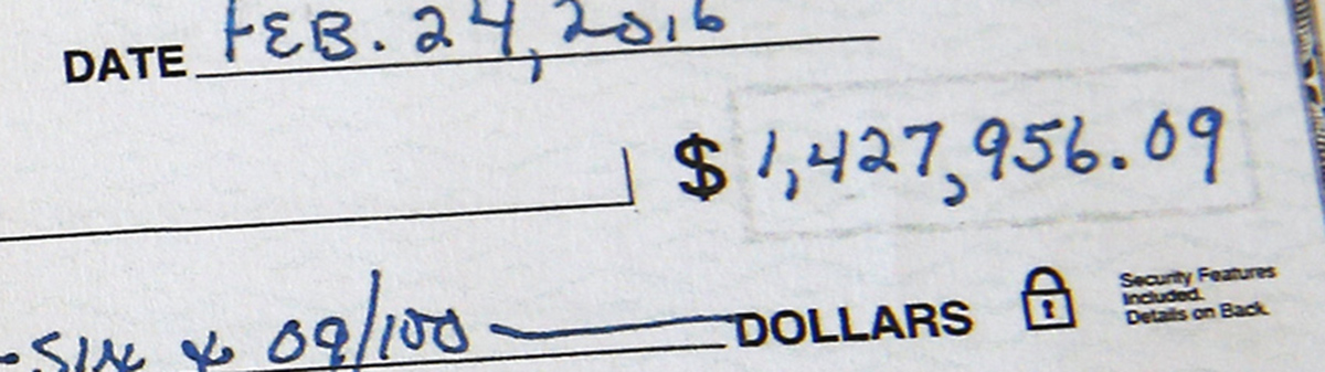A close look at the check written to the library.