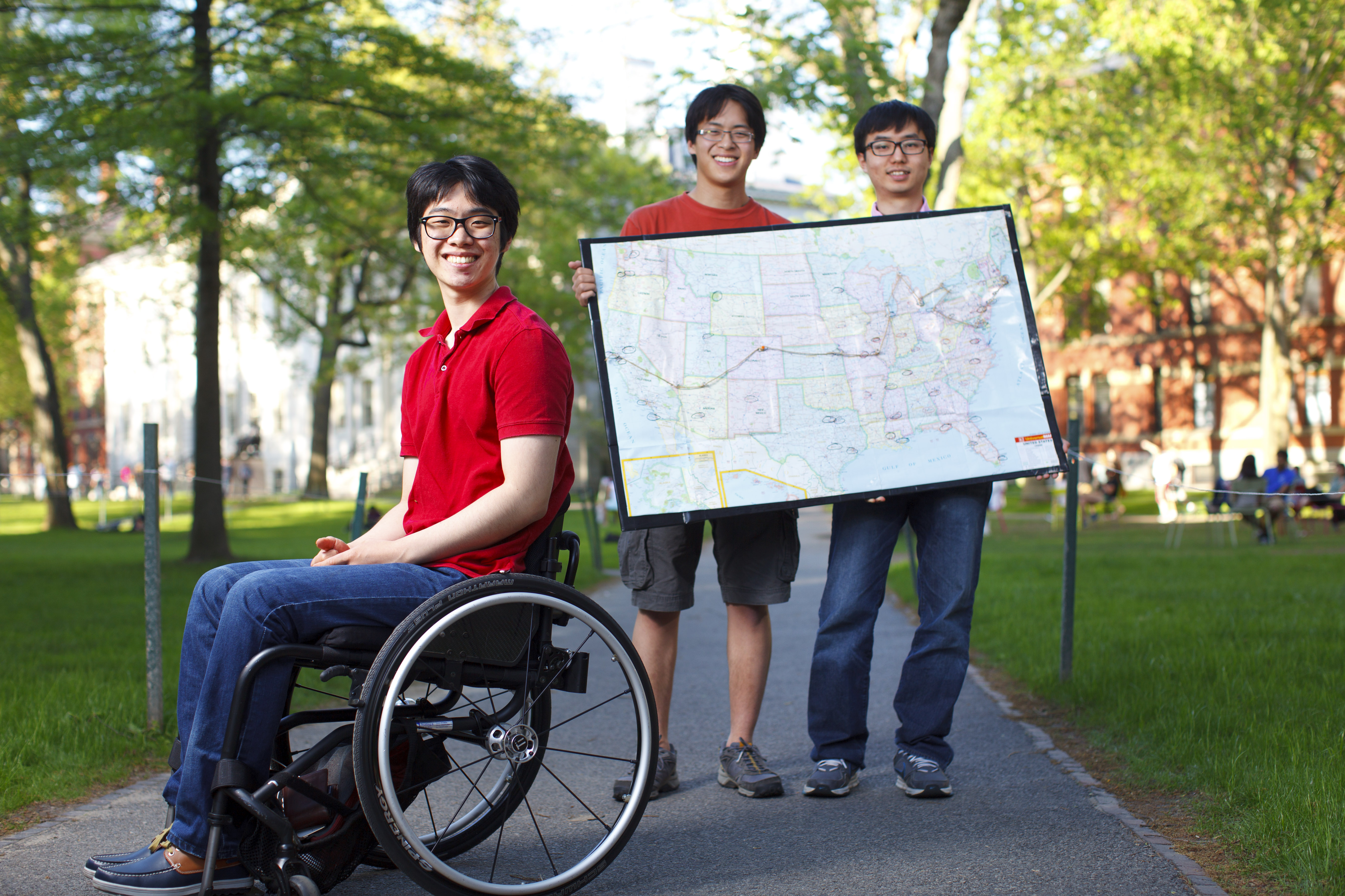 Harvard students (from left) Kunho Kim, Brad Riew, and You-Myeong Kim and a fourth friend, Cynthia Cheung, a student at the University of Bath, England, will drive from Boston to Los Angeles along the route they have plotted in a wheelchair accessible van that Kunho can drive.