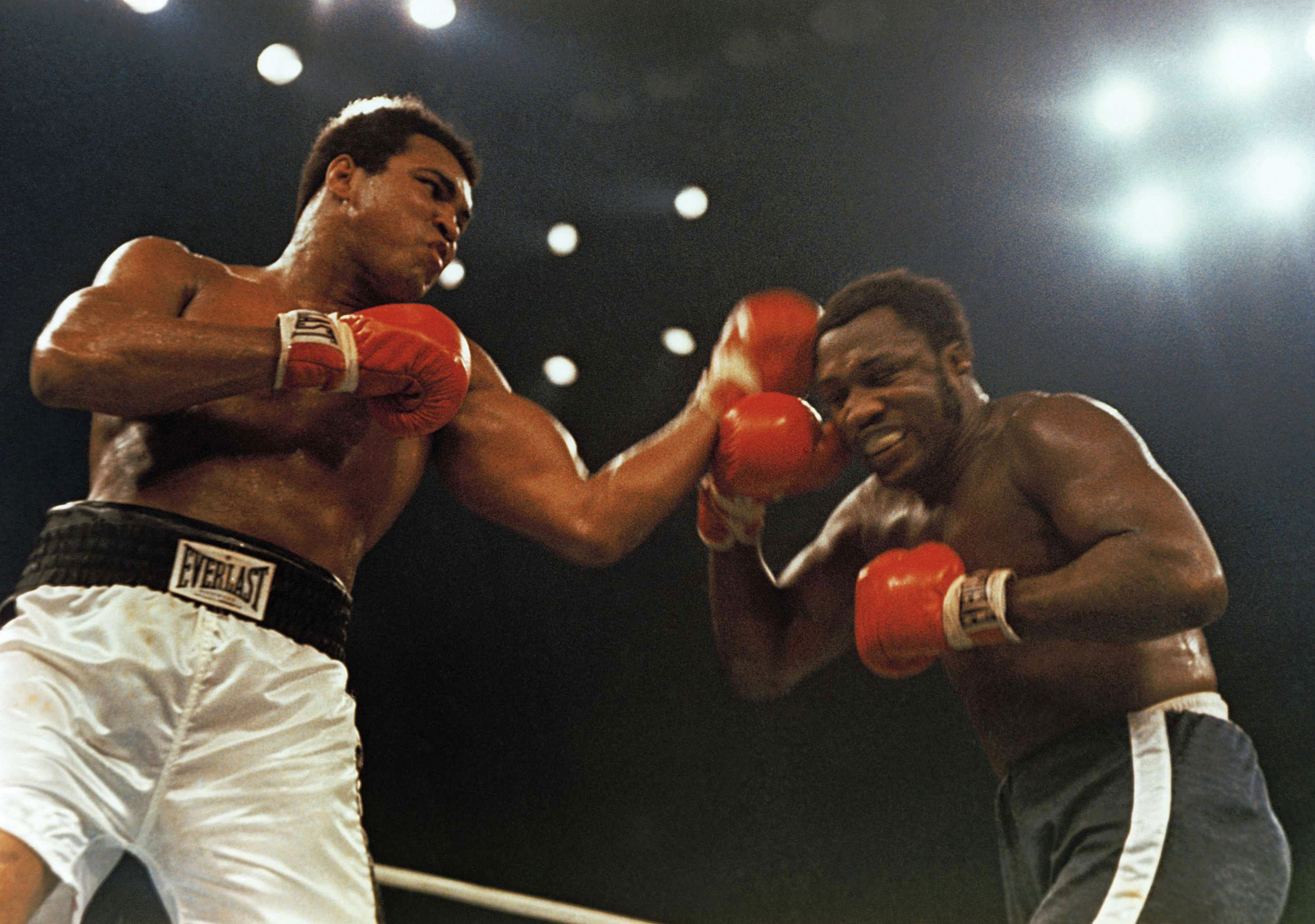 Muhammad Ali, left, and Joe Frazier fight in a 12-round non-title fight.