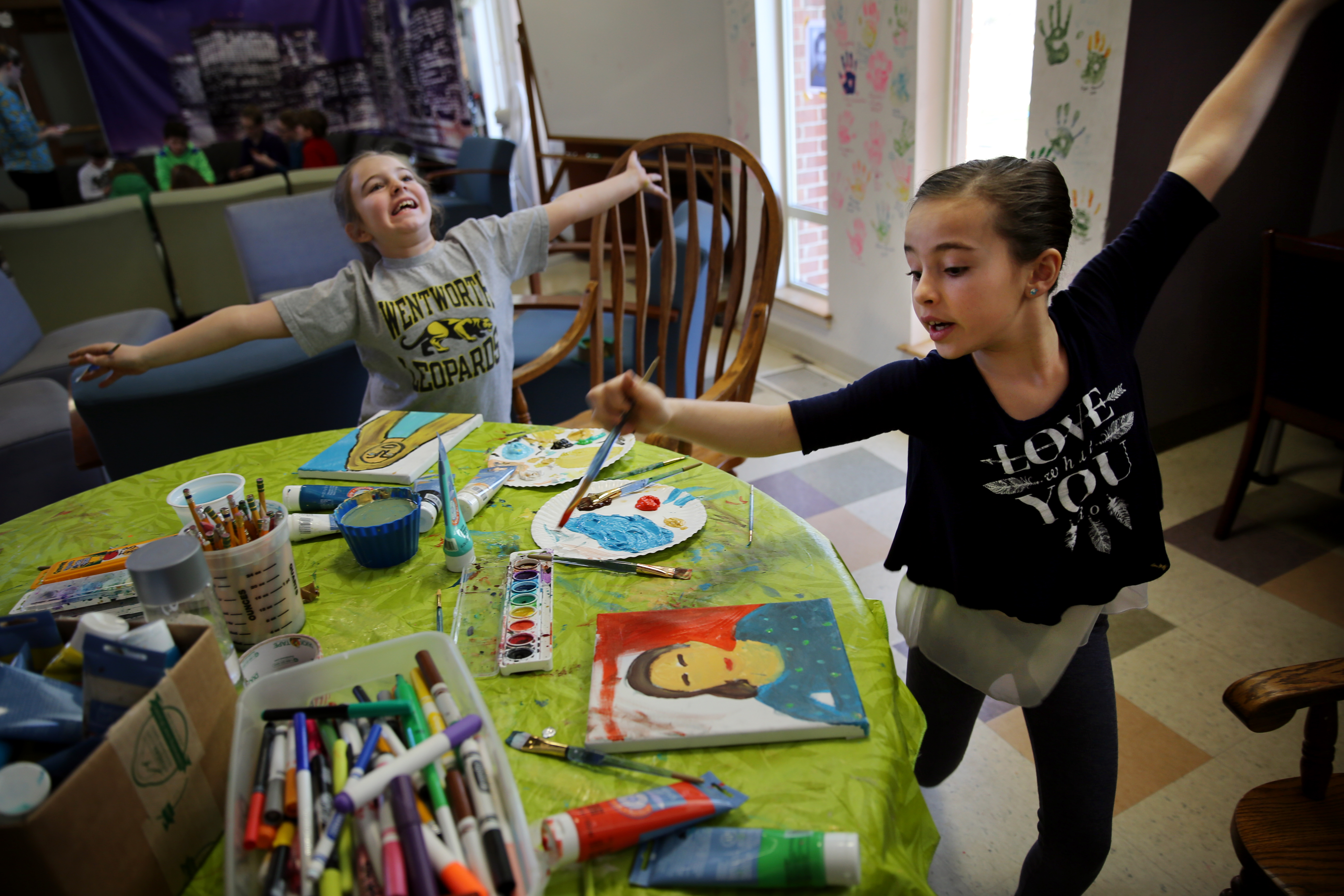 From Left: Ania Manning, 9, and Autumn Cooney danced while painting self-portraits during "Selfie Camp" at the Duxbury Student Union.
