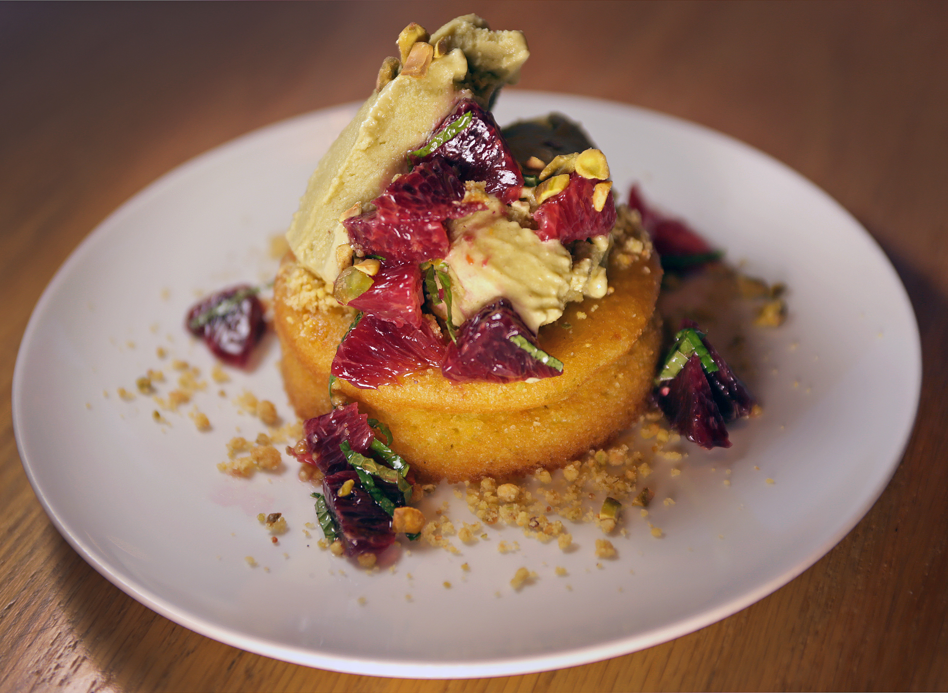 Lime polenta cake with blood orange, mint, and pistachio gelato.