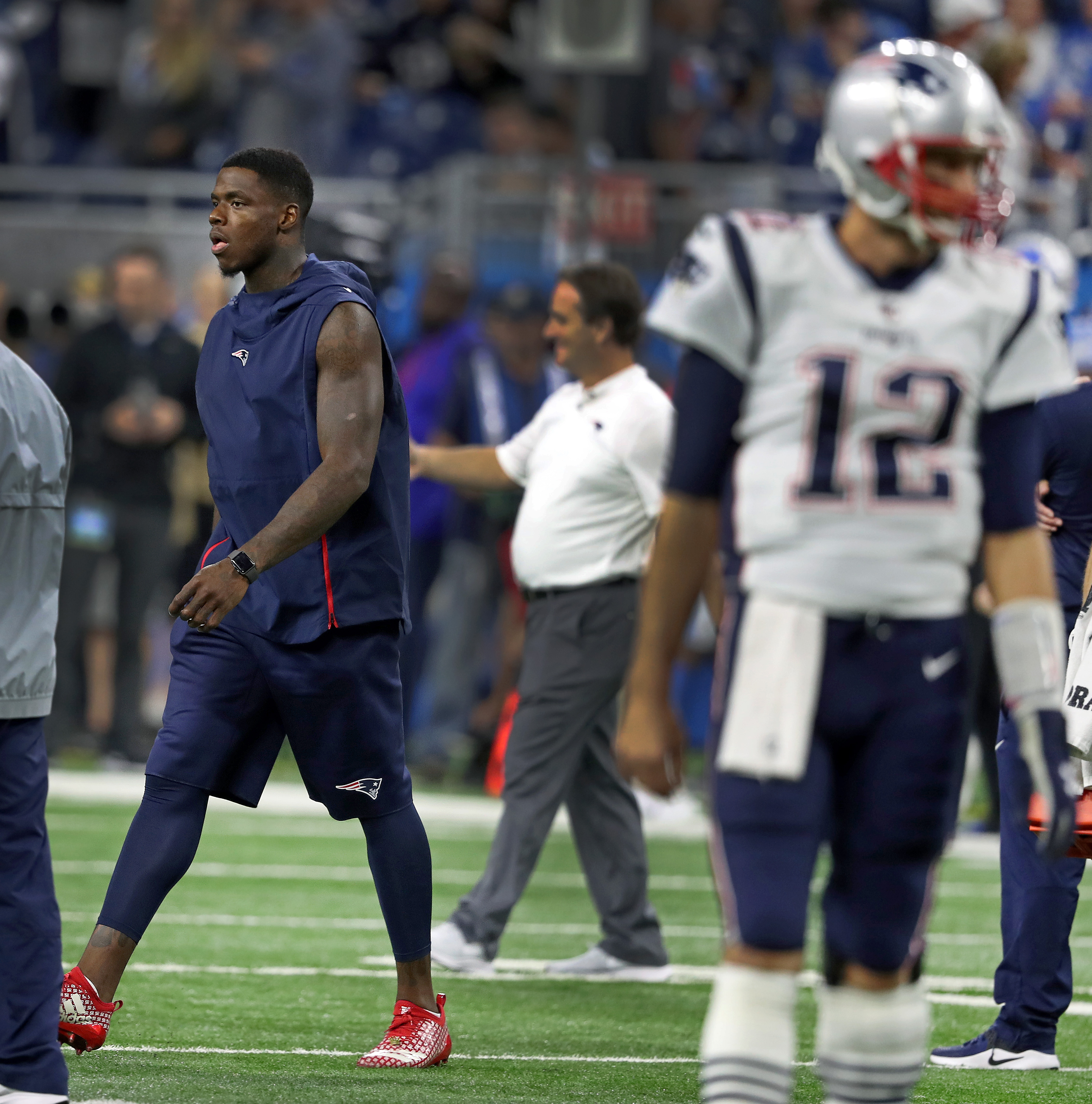 Patriots quarterback Tom Brady was in uniform on the field during pregame warmups, but wide reciever Josh Gordon (left) was not after being ruled inactive.
