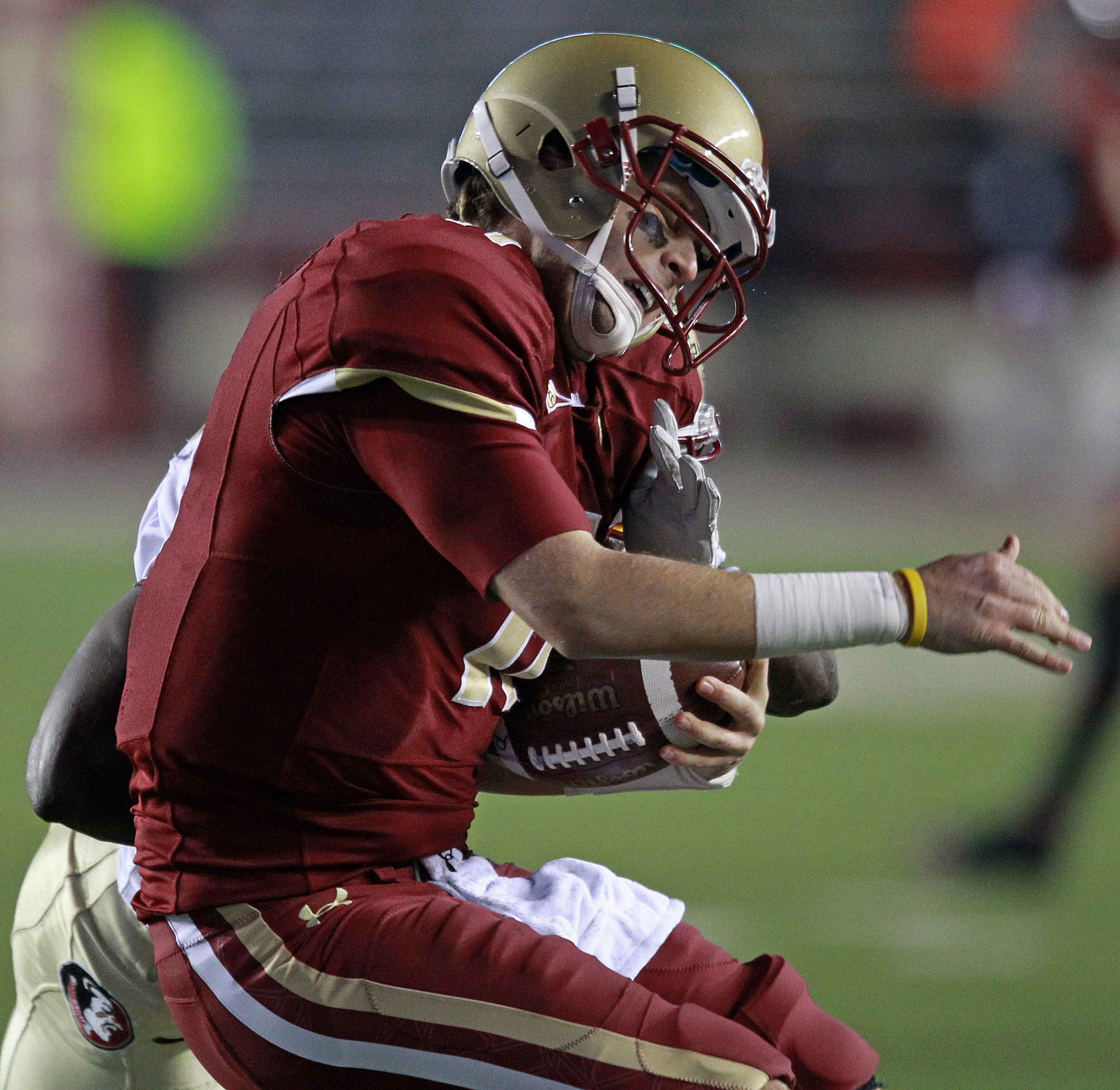 BC quarterback Chase Rettig was jarred by a Florida State defender as he tried to scramble during last night’s loss.