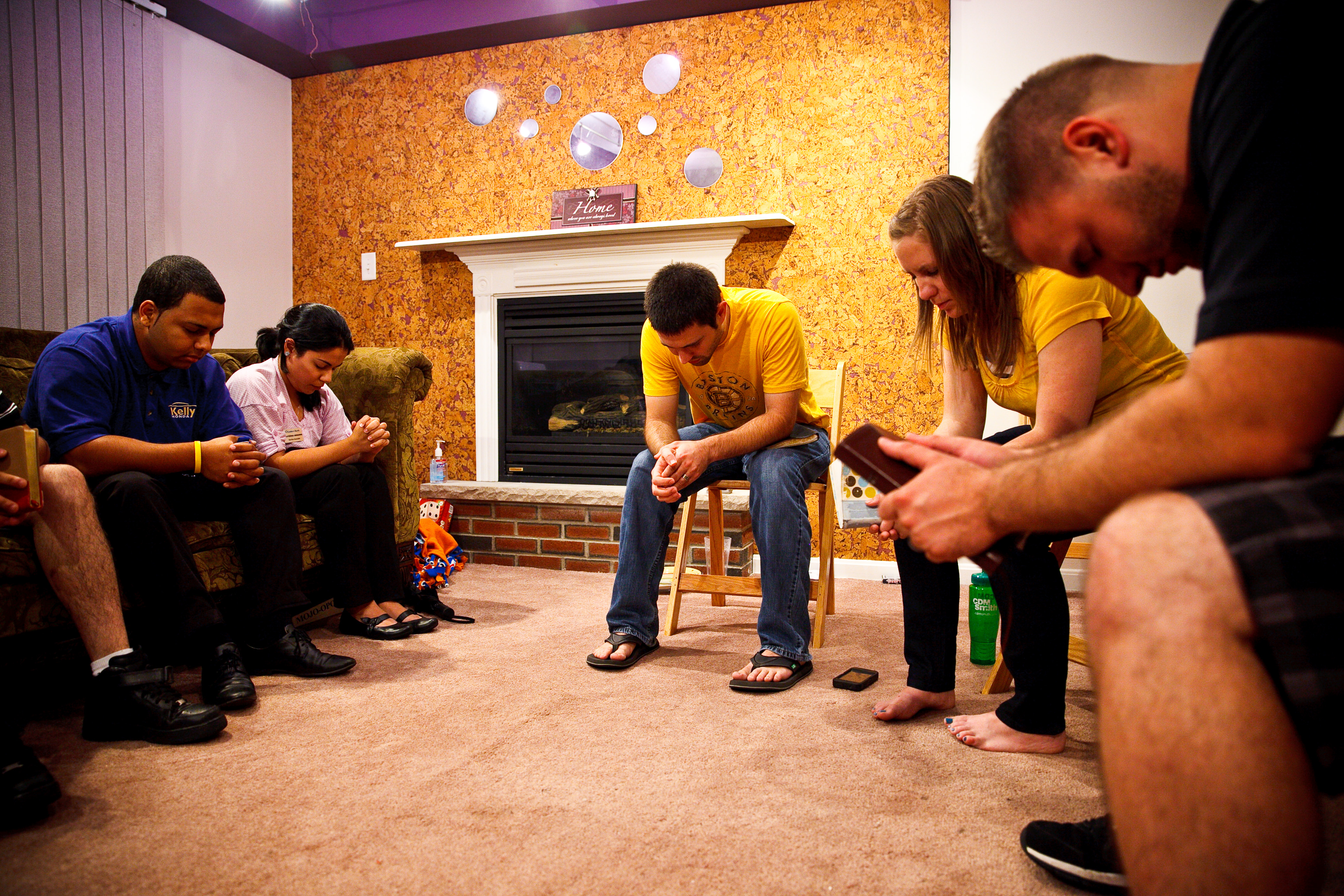A prayer meeting at the apartment shared by the TrueVine Church team.