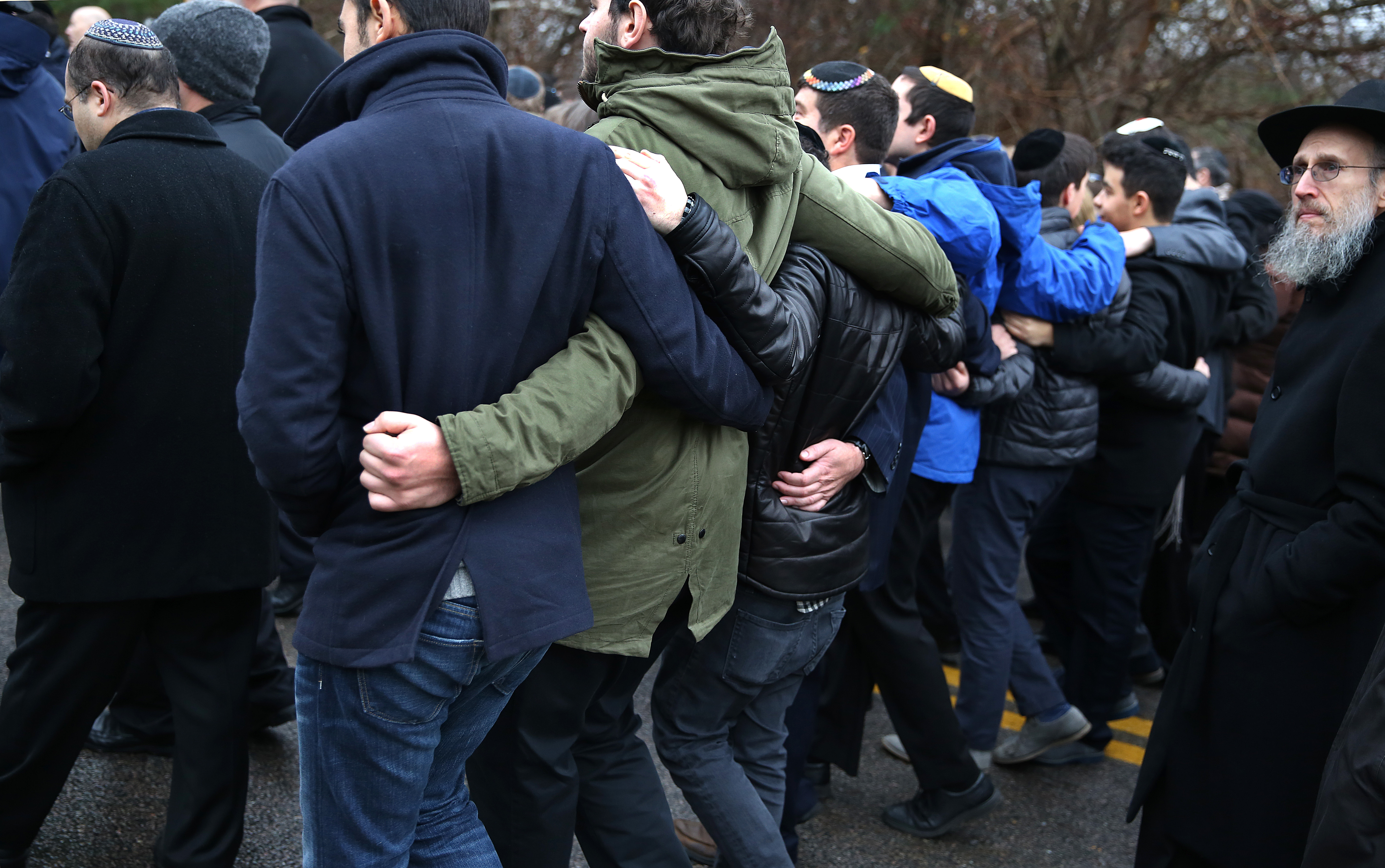 Family and friends gathered outside Temple Sinai in Sharon after Ezra Schwartz’s funeral.
