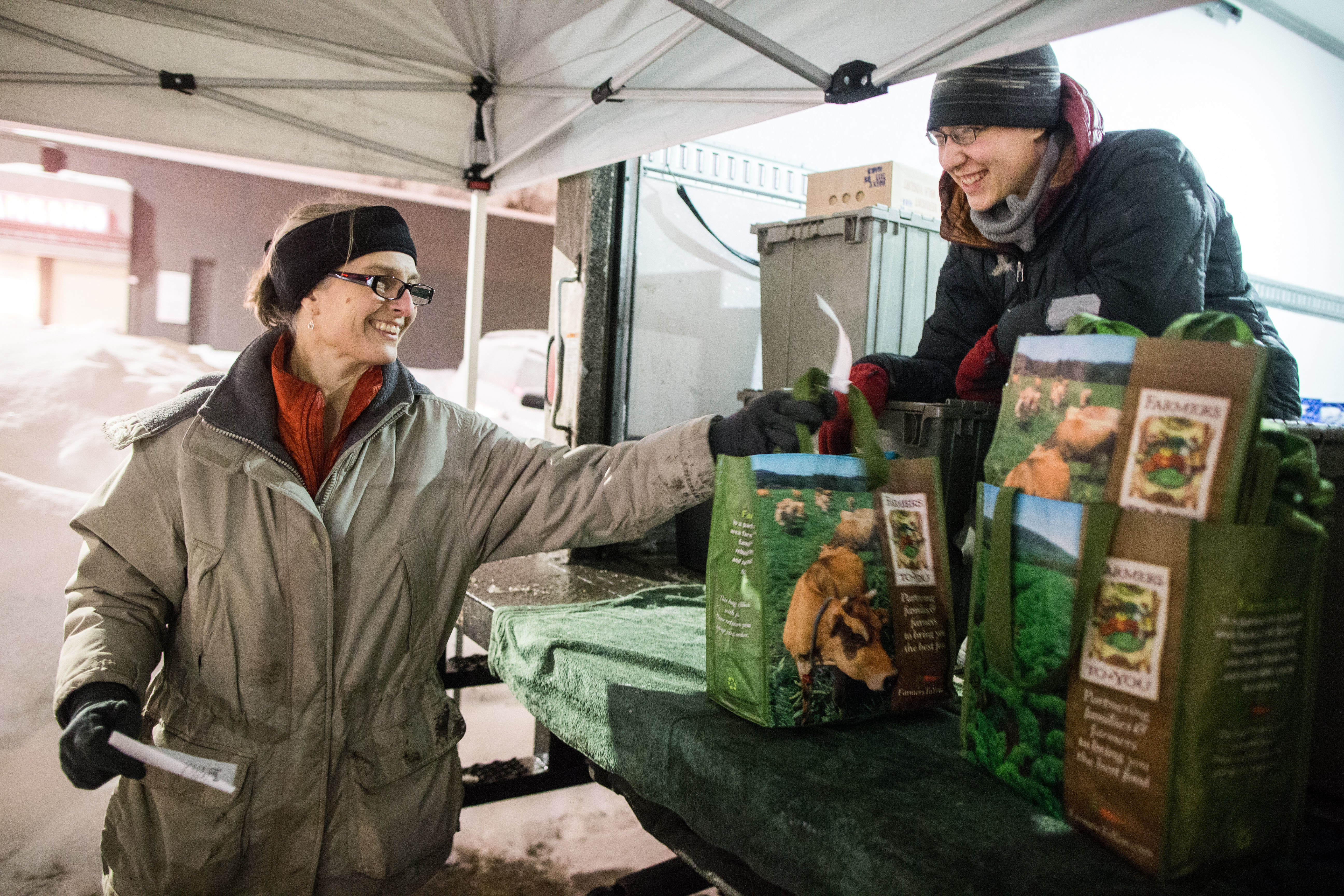 Site host Liz McNerny and driver M. Murphy at Farmers to You pickup location in Cambridge.