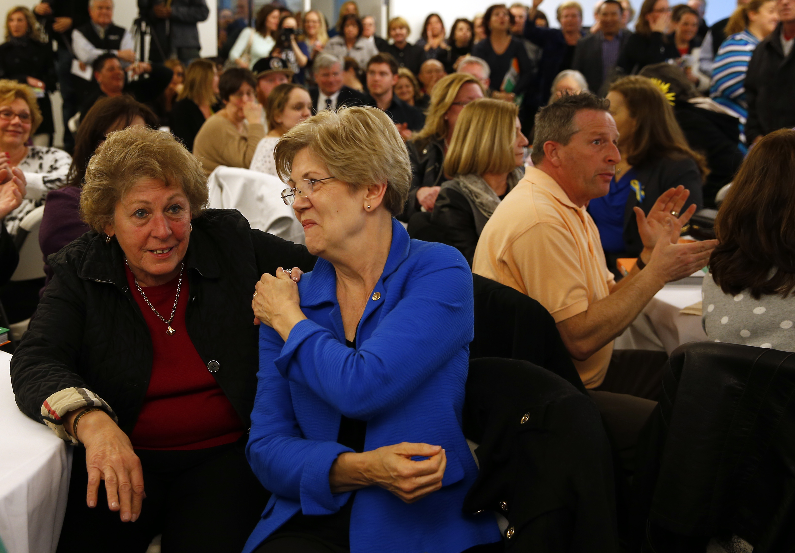 Senator Elizabeth Warren grabbed Angela Menino’s hand as the pair together donated $1,000 during the fundraiser on Thursday.