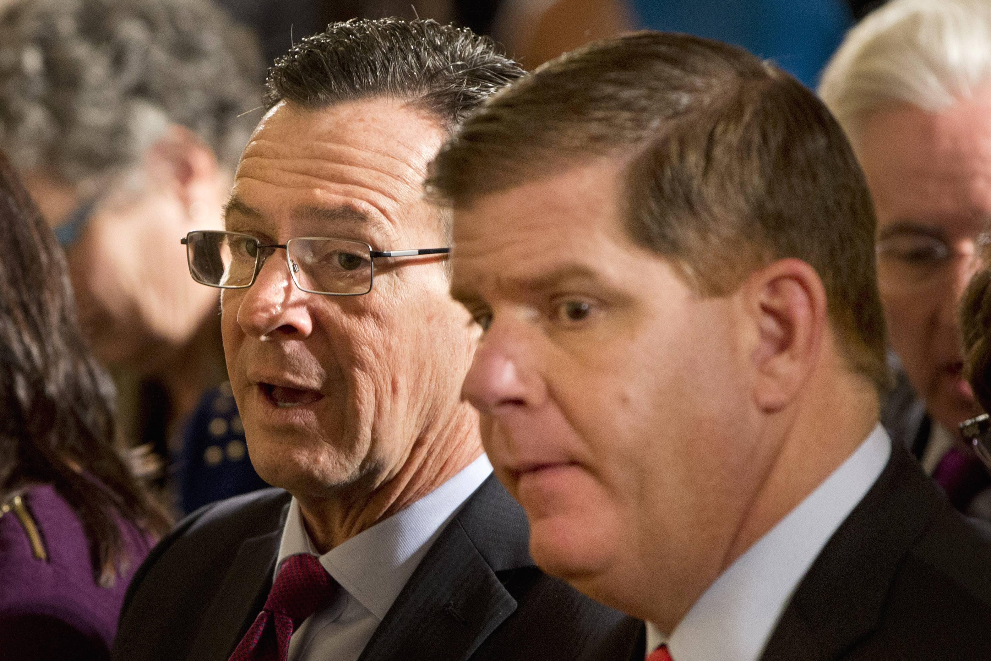 Boston Mayor Marty Walsh sat in the East Room of the White House in Washington before President Barack Obama arrived to speak.