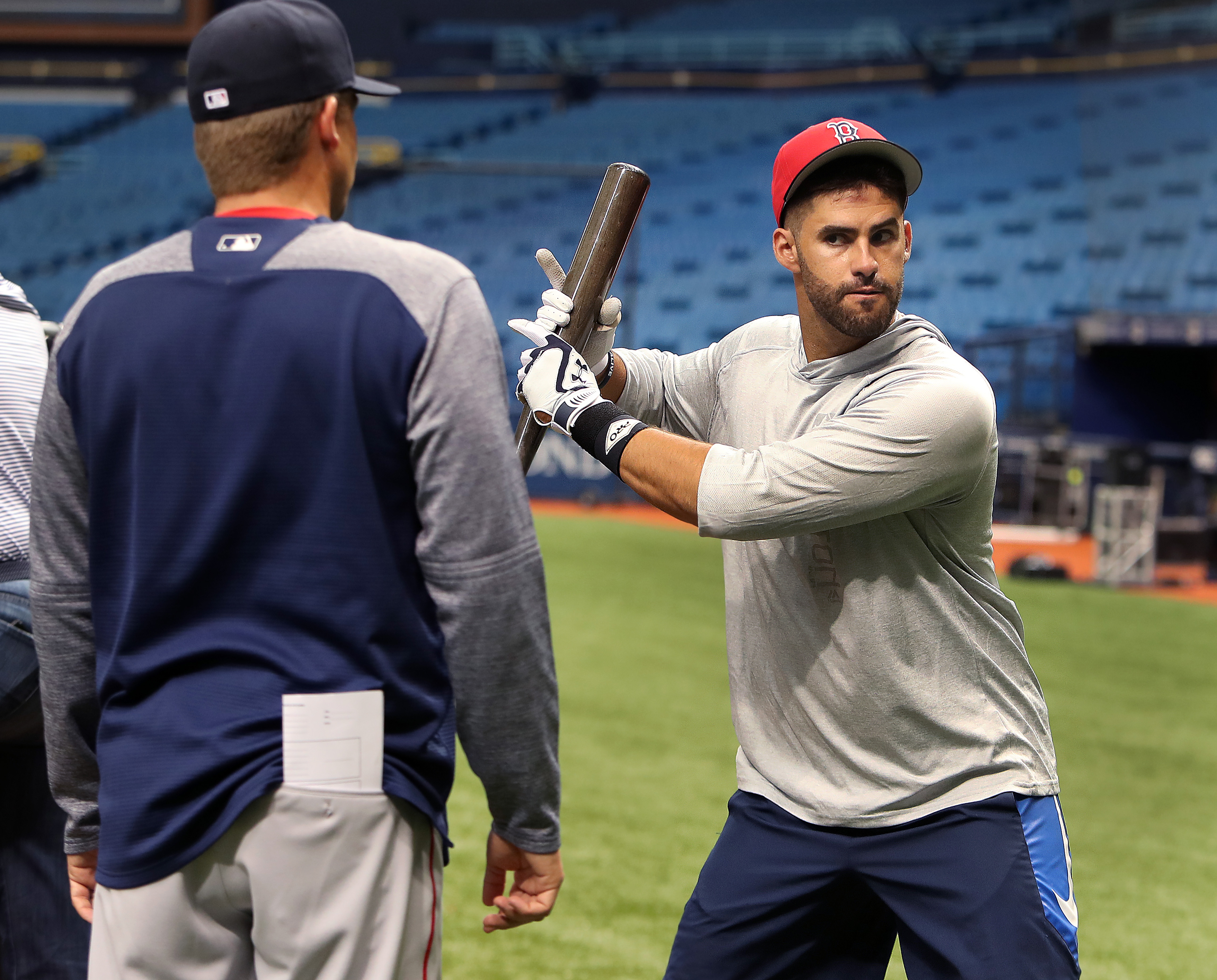 Red Sox hitting coach Tim Hyers works with J.D. Martinez on his swing before opening day of the 2018 season.