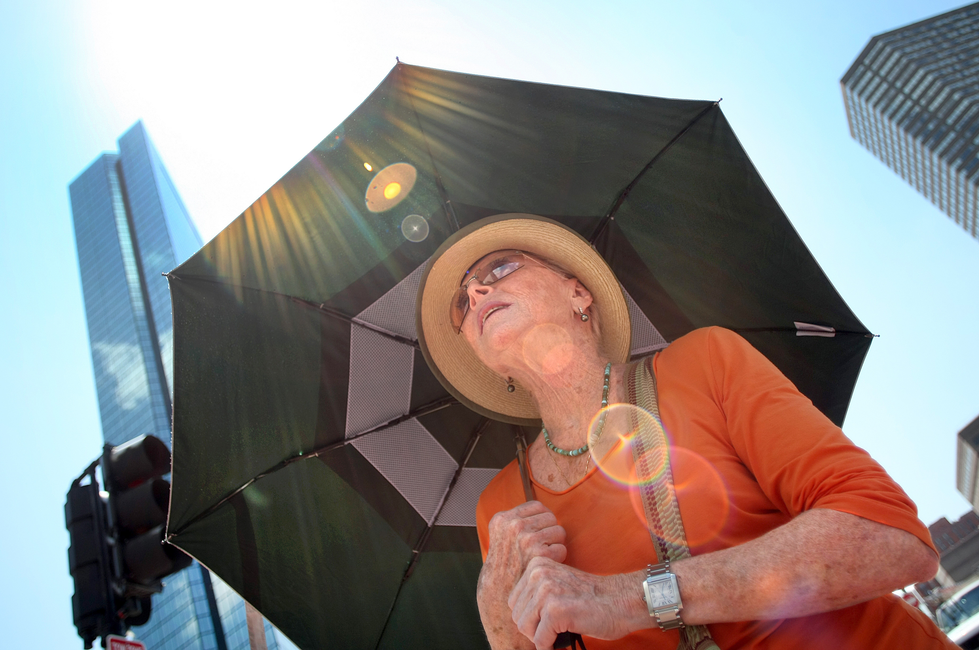 Jeanette Newman from Boston is trying to limit her exposure to the sun.