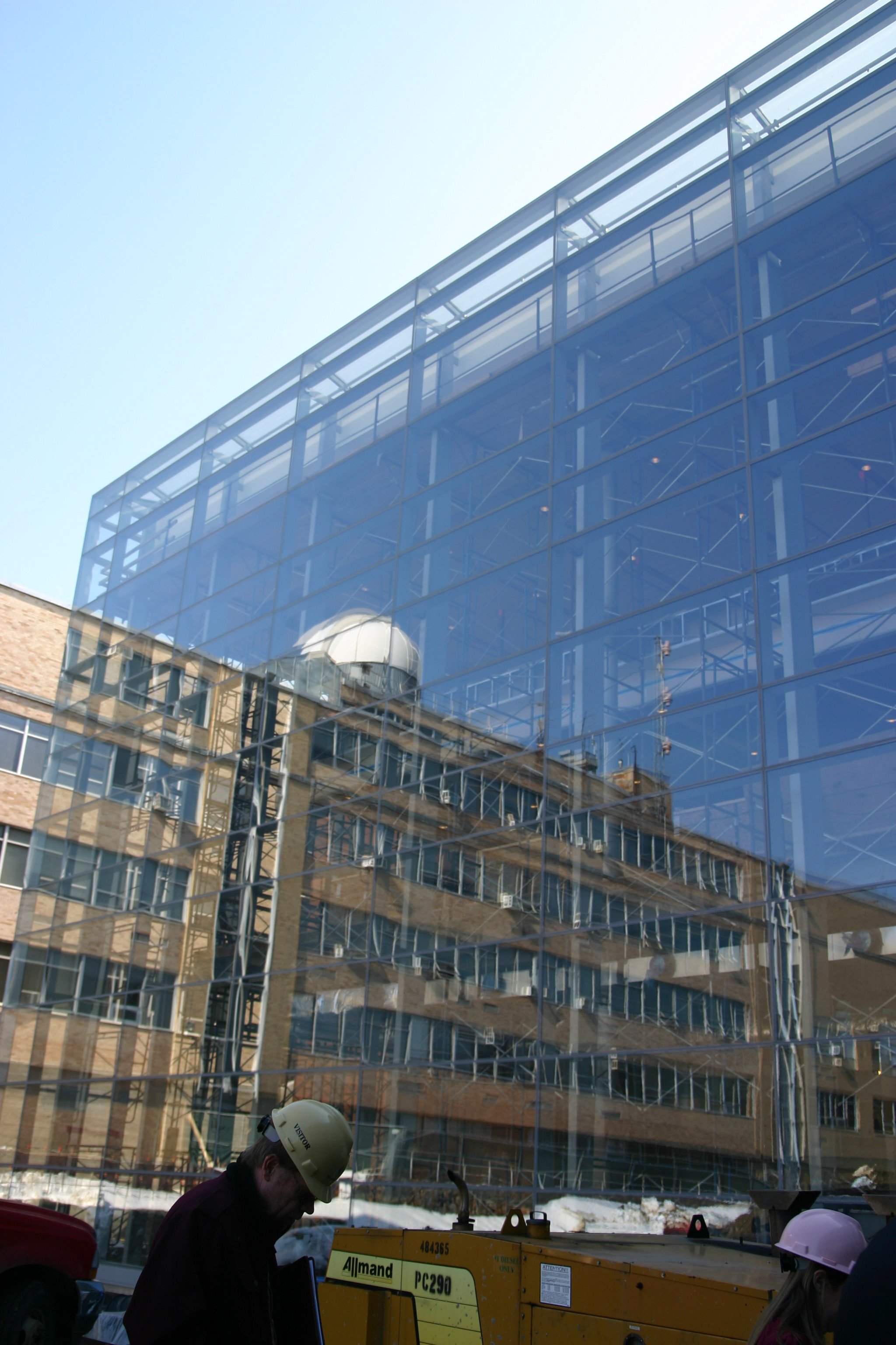 The all-glass windows allow natural light to seep into the building.