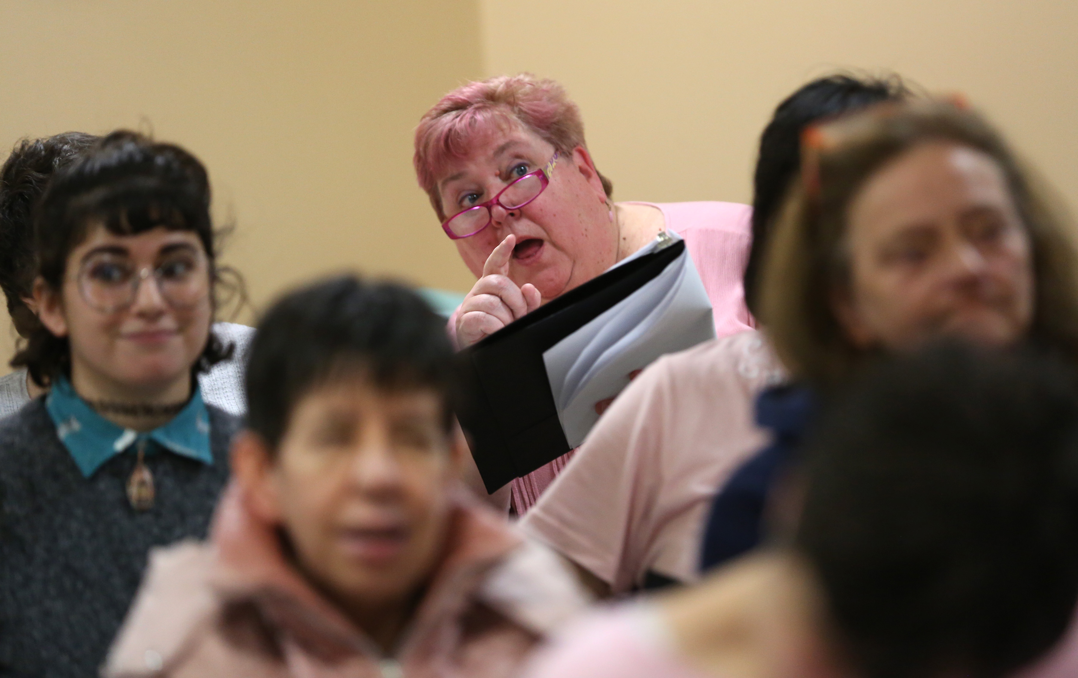 Eve Montague encourages a member of the South Shore Voices Chorus to look at the conductor as they work through “My Dear Acquaintance” during their practice at the South Shore Conservatory.