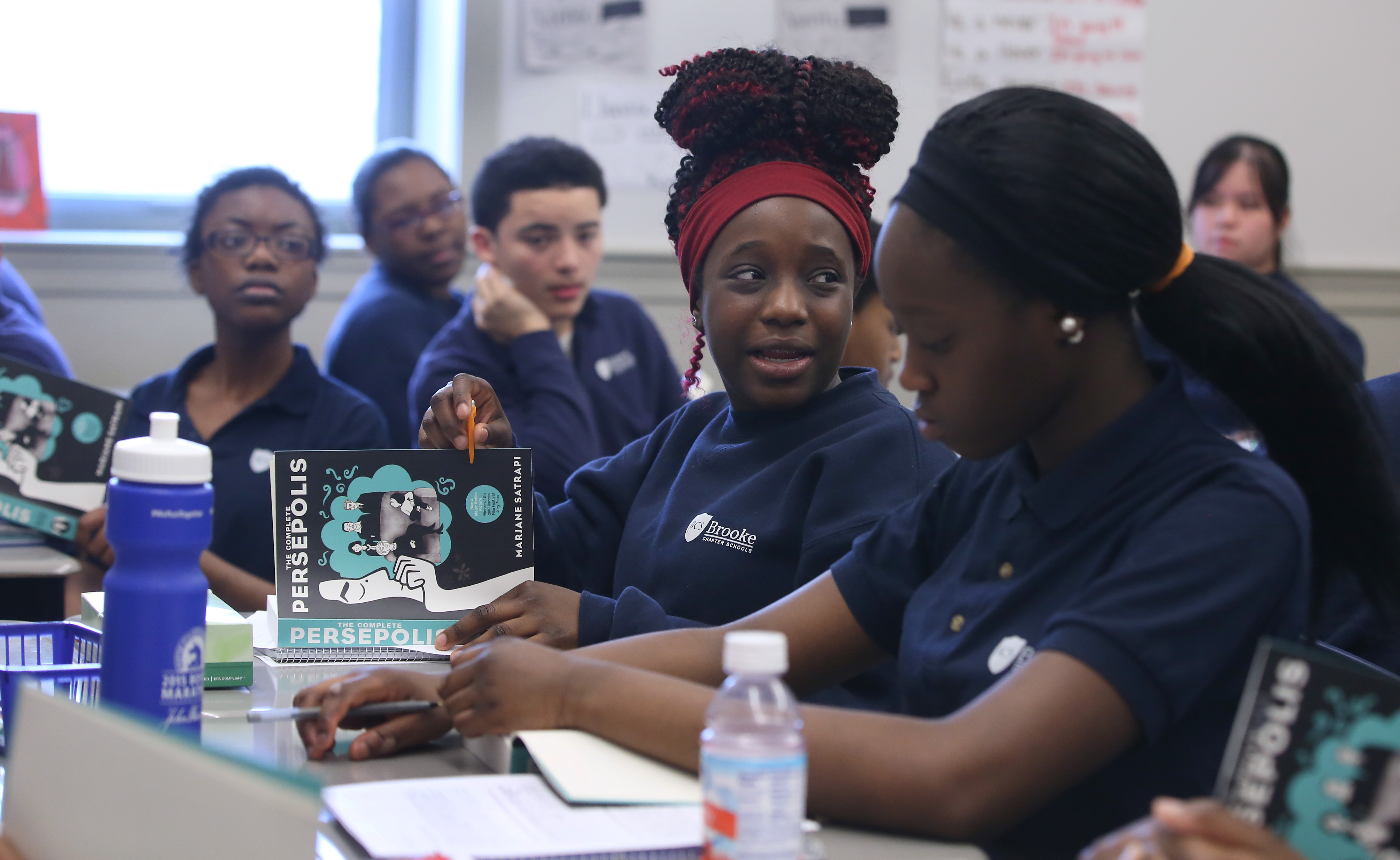 Geraldine Louis (second from right), 15, participated in a discussion in Azzari’s English class.