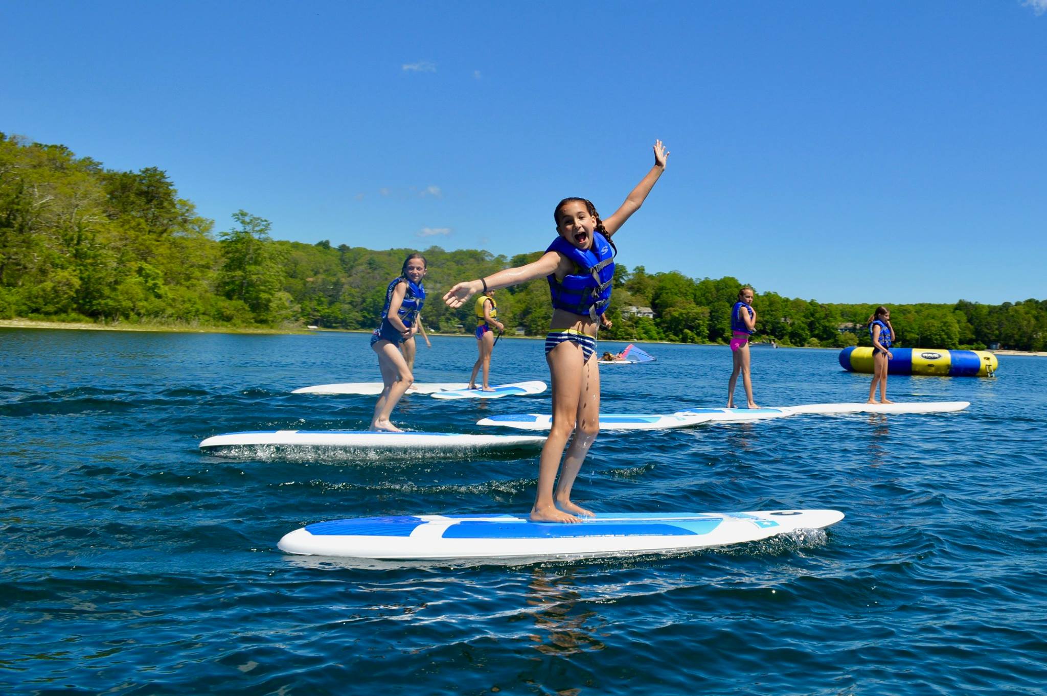 Girls having fun — without cellphones — at the South Shore YMCA's Camp Hayward.