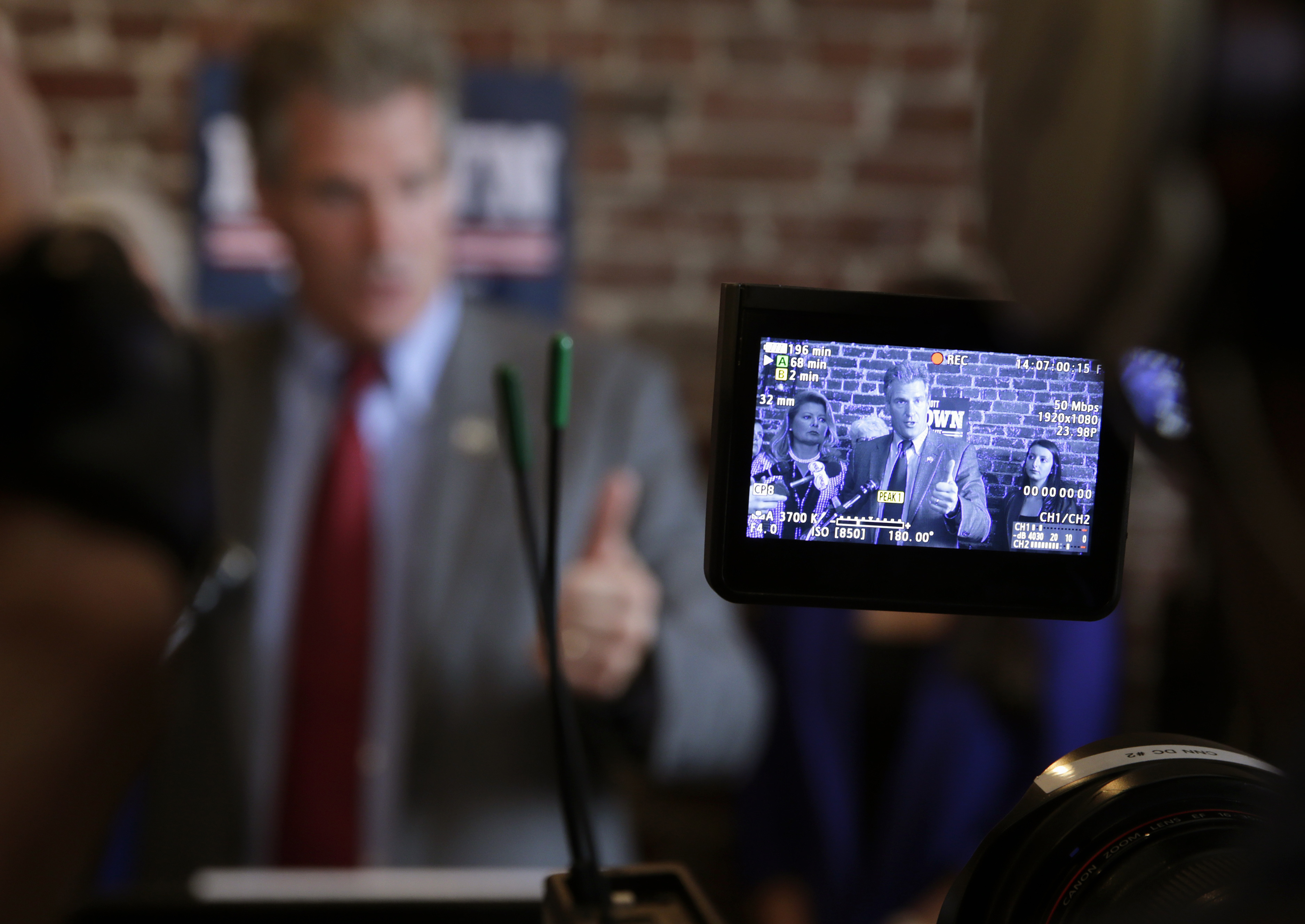 New Hampshire Republican candidate Scott Brown is seen through the view finder of a camera during a campaign stop in Derry, N.H.