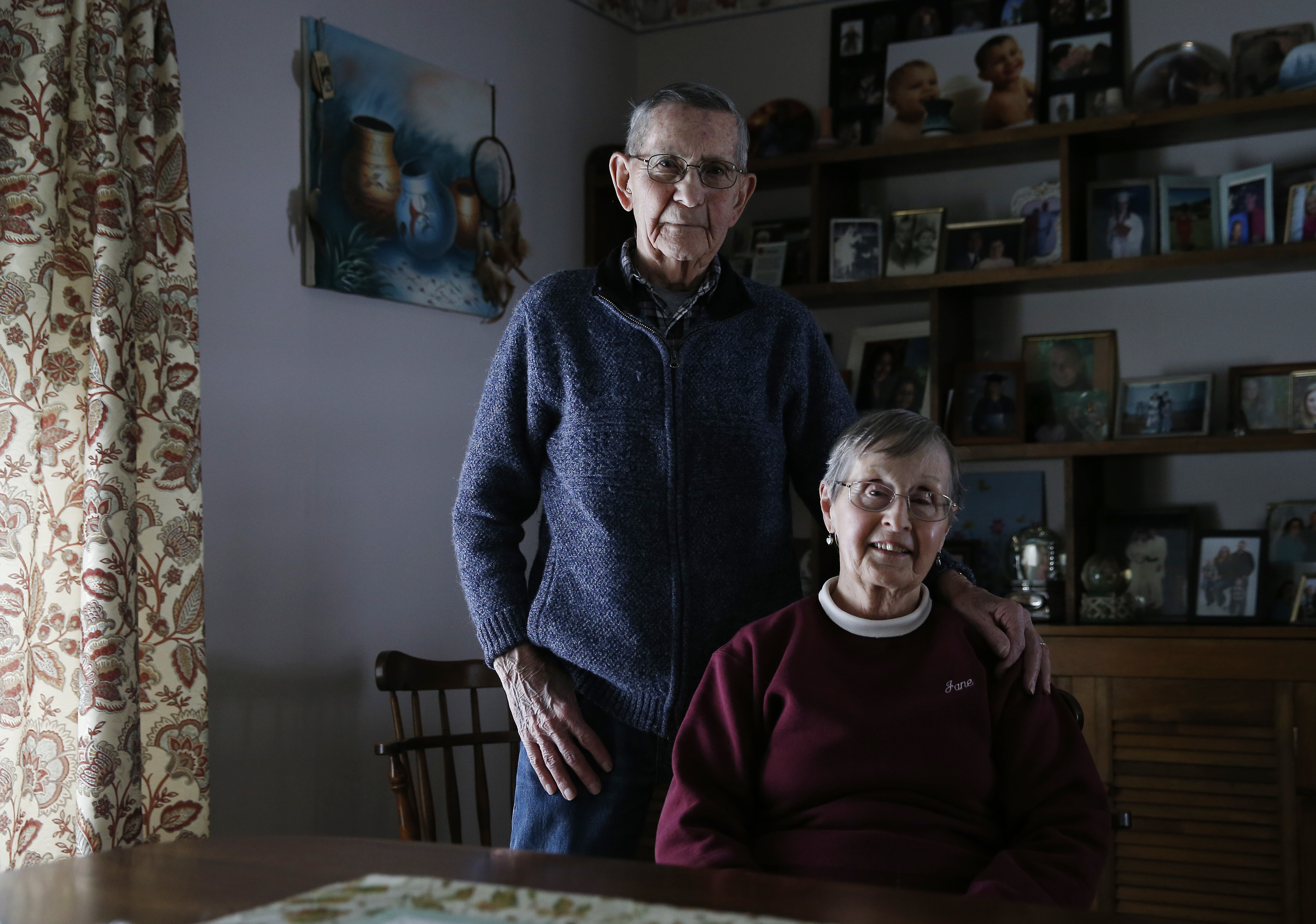 Ted Marshall, 87, and his wife, Jane posed for a portrait inside their home.