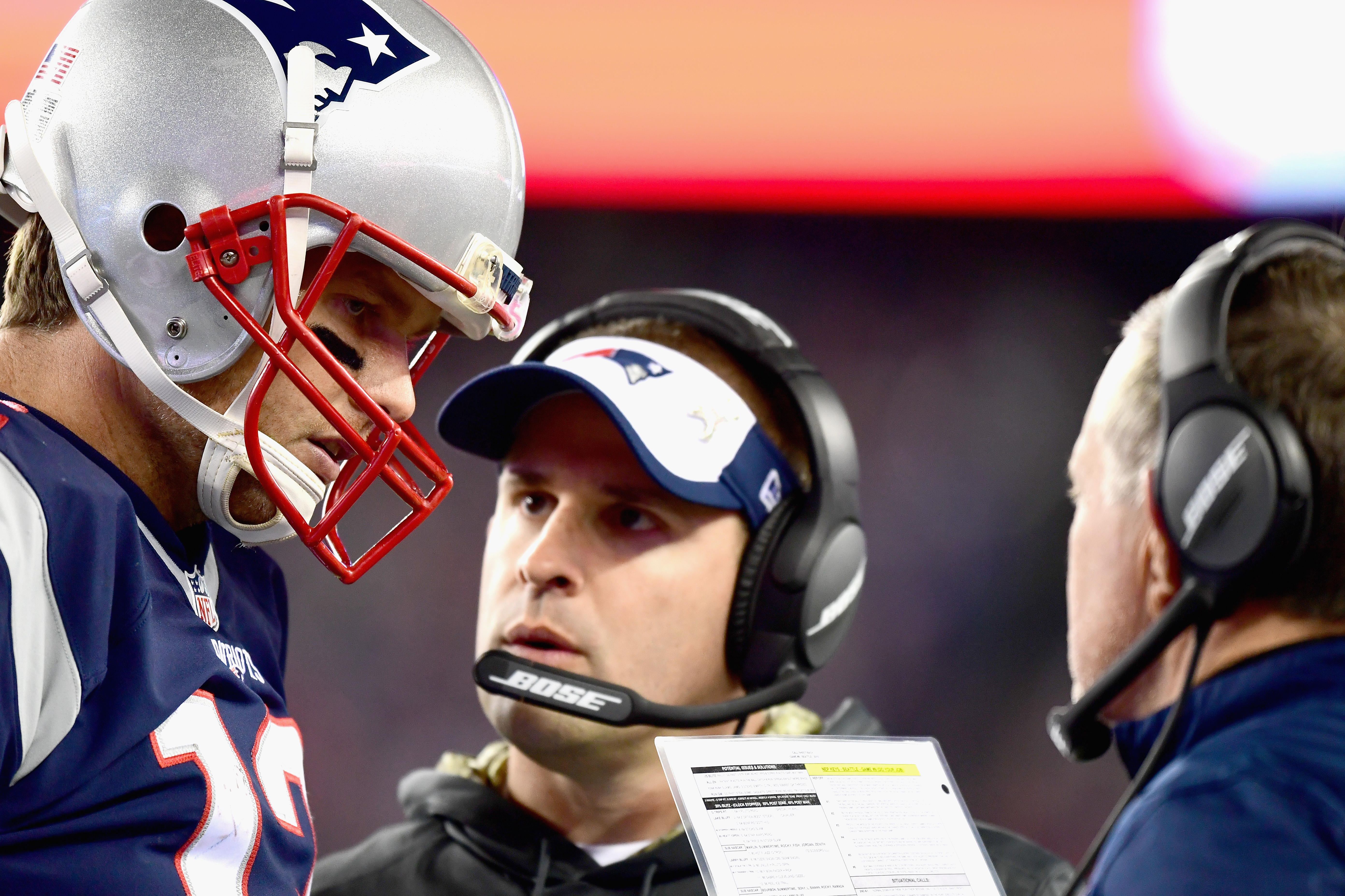 In February, McDaniels (shown with Brady and Belichick during a 2016 game) changed his mind about taking the head coach job in Indianapolis.
