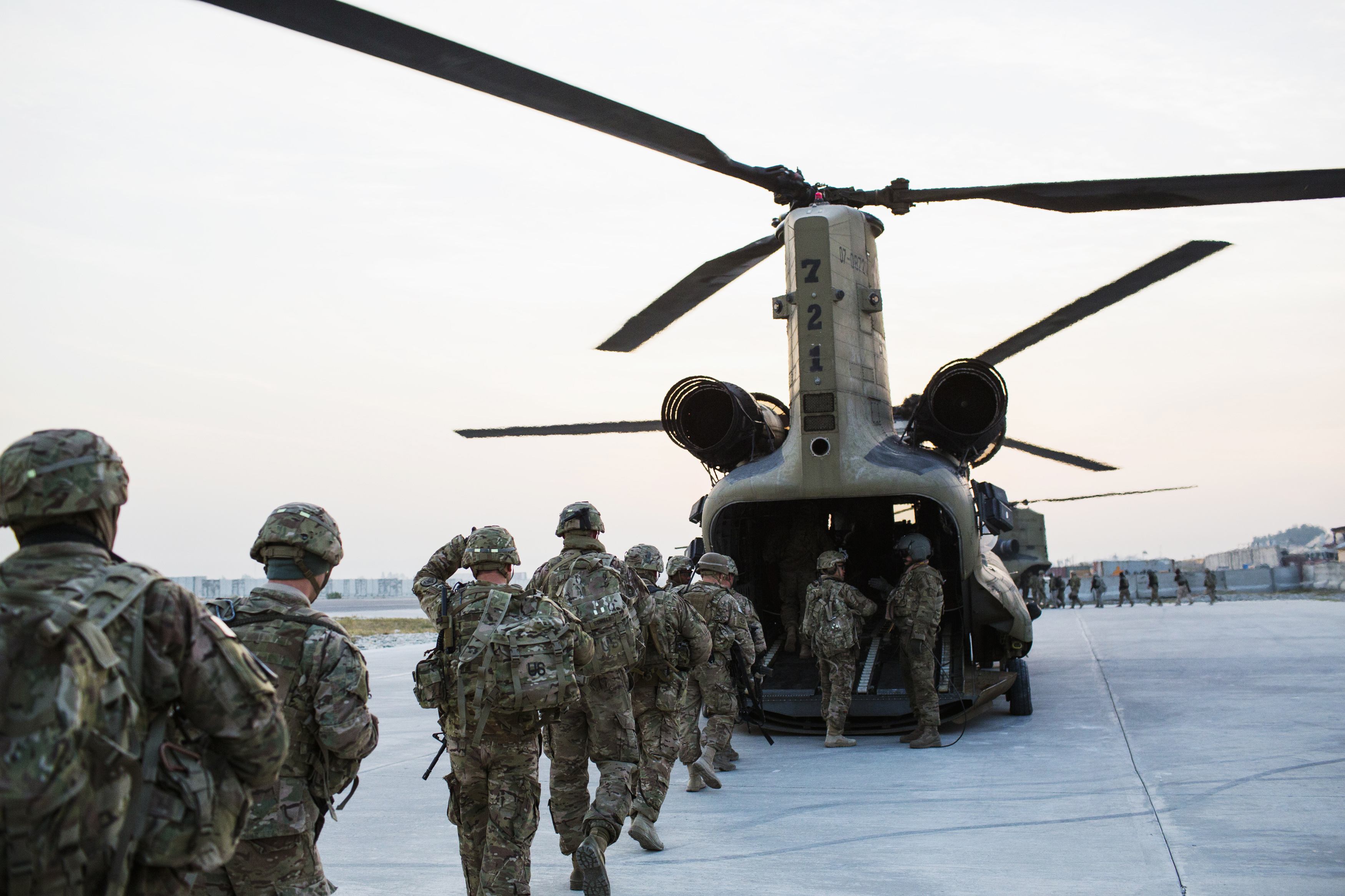 US soldiers loaded into a Chinook helicopter for an advising mission to Afghanistan Dec. 21.