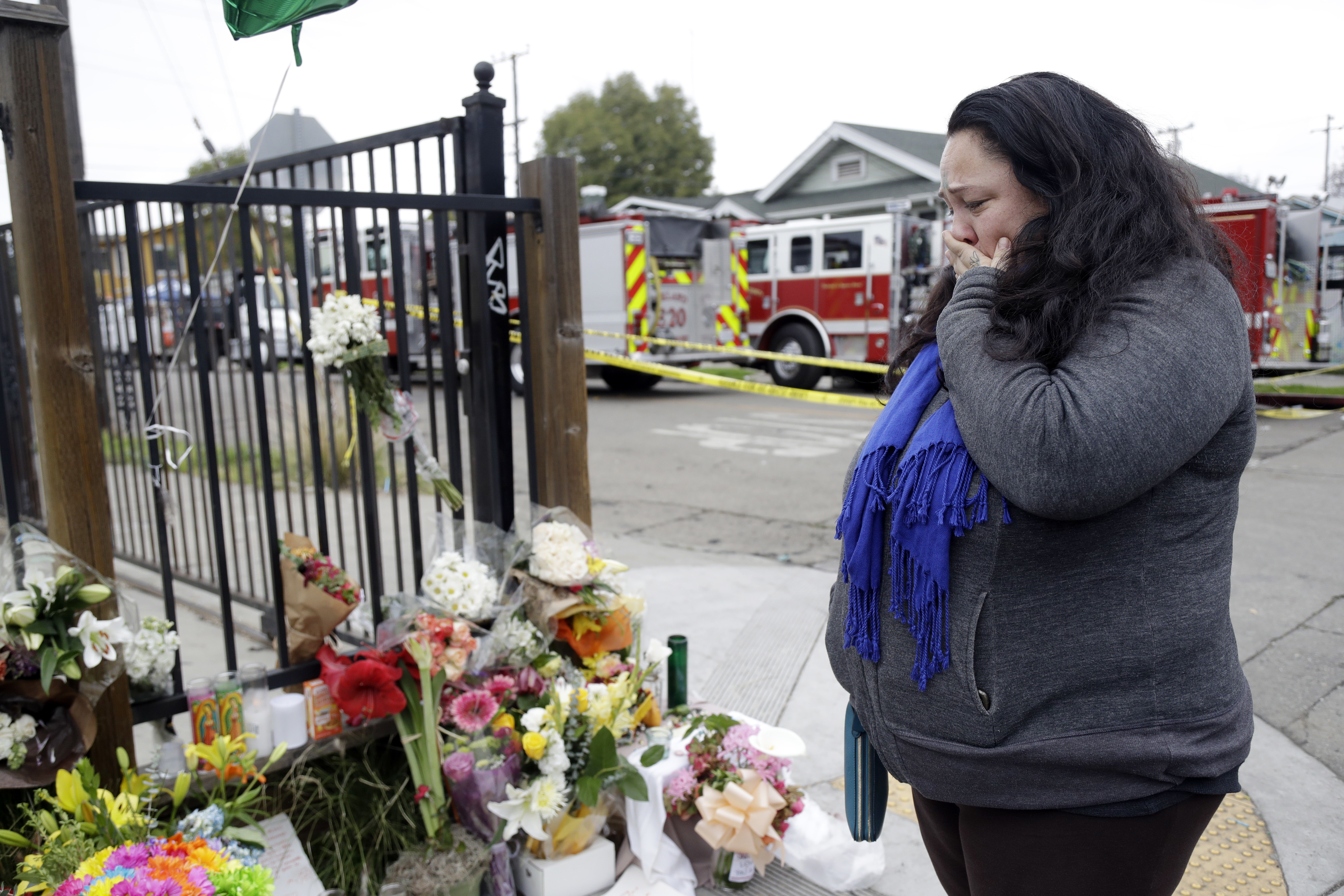 Danielle Boudreaux stood at a memorial near the site of the fire.