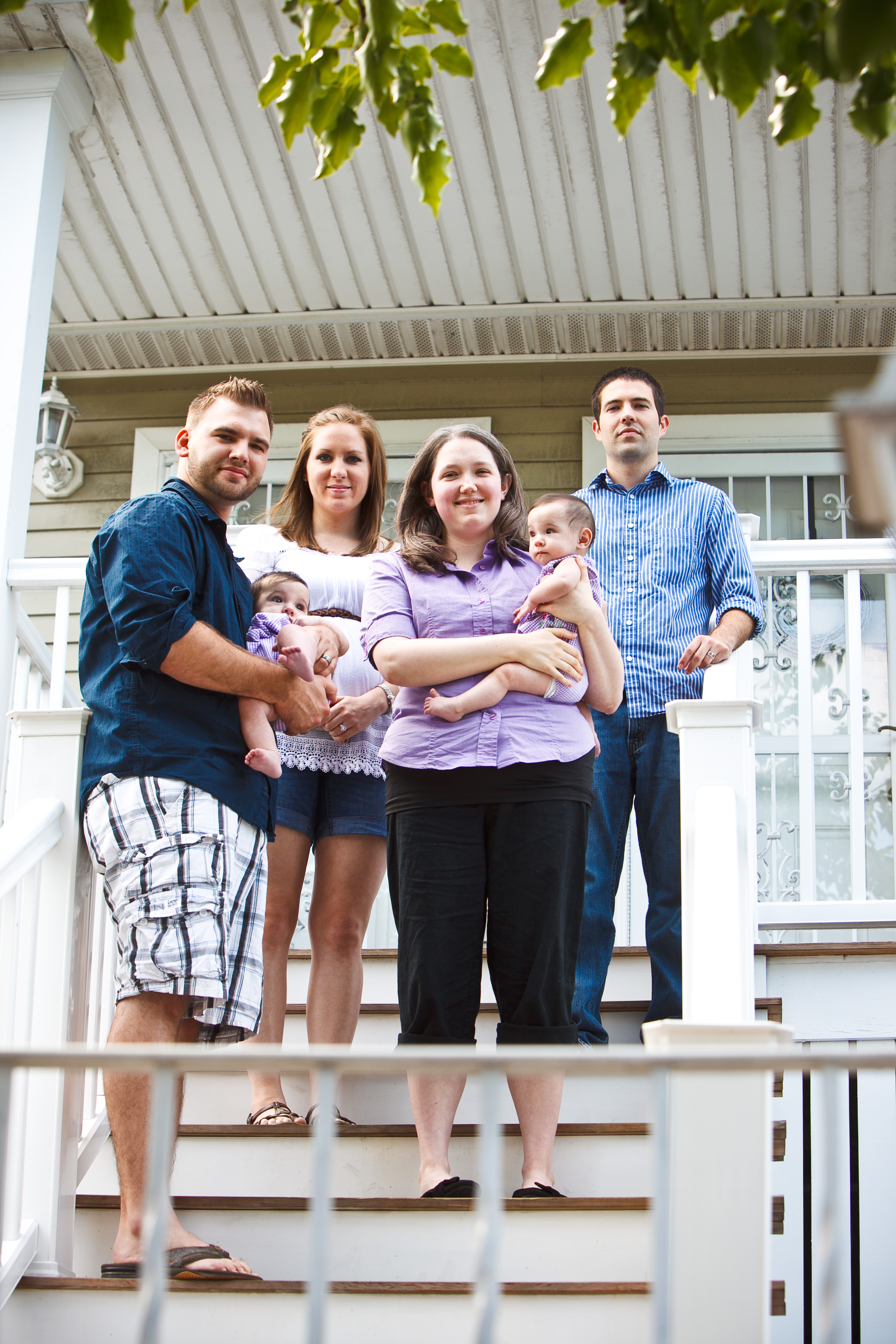 Myke and Britney Wilkerson (holding their twin daughters) and Miryam and Brandon Allison
