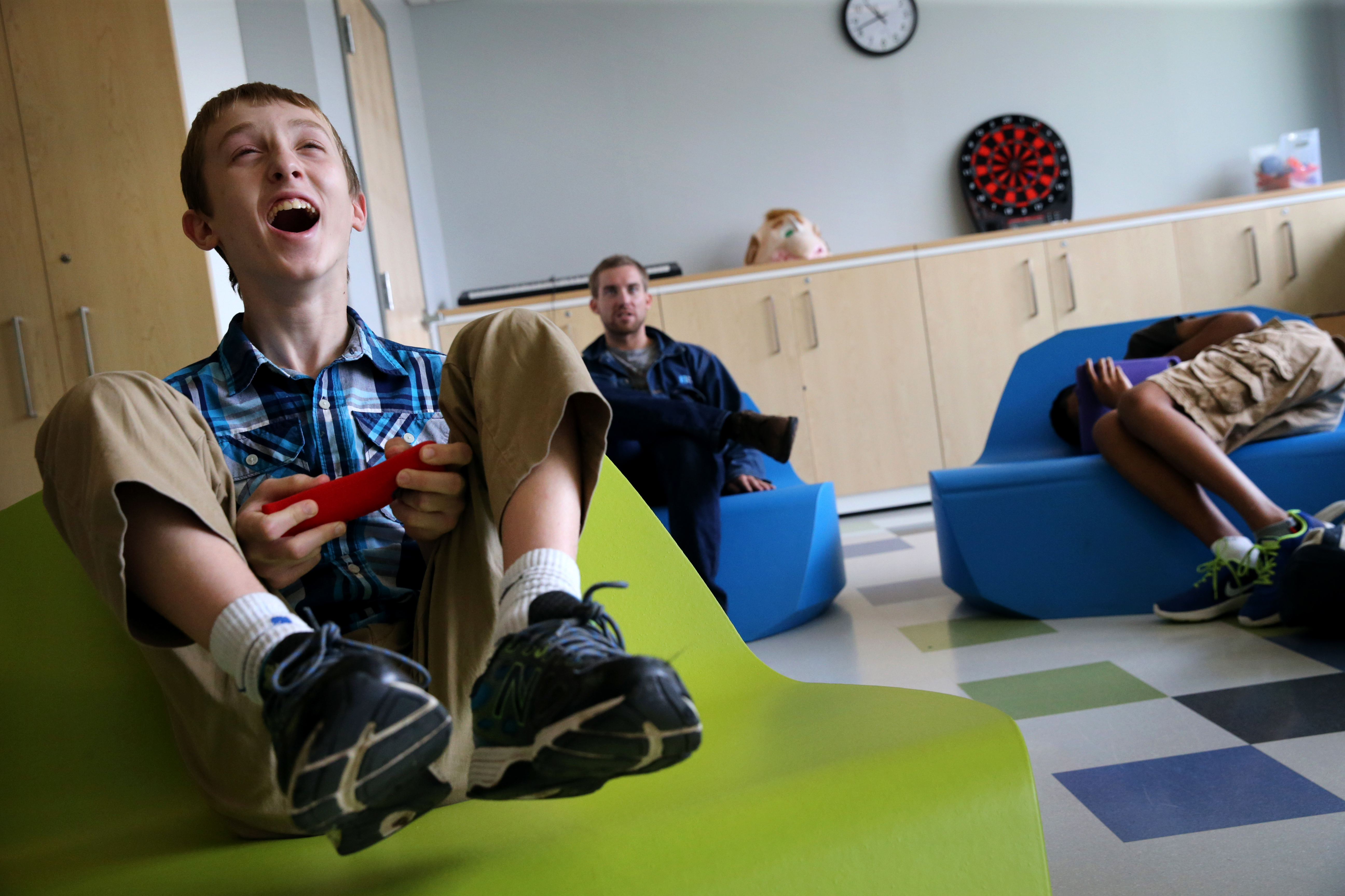 Connor played a video game in the leisure center at the New England Center for Children in Southborough. At the residential school for children with autism, even play time is an opportunity for adults to teach students social skills.