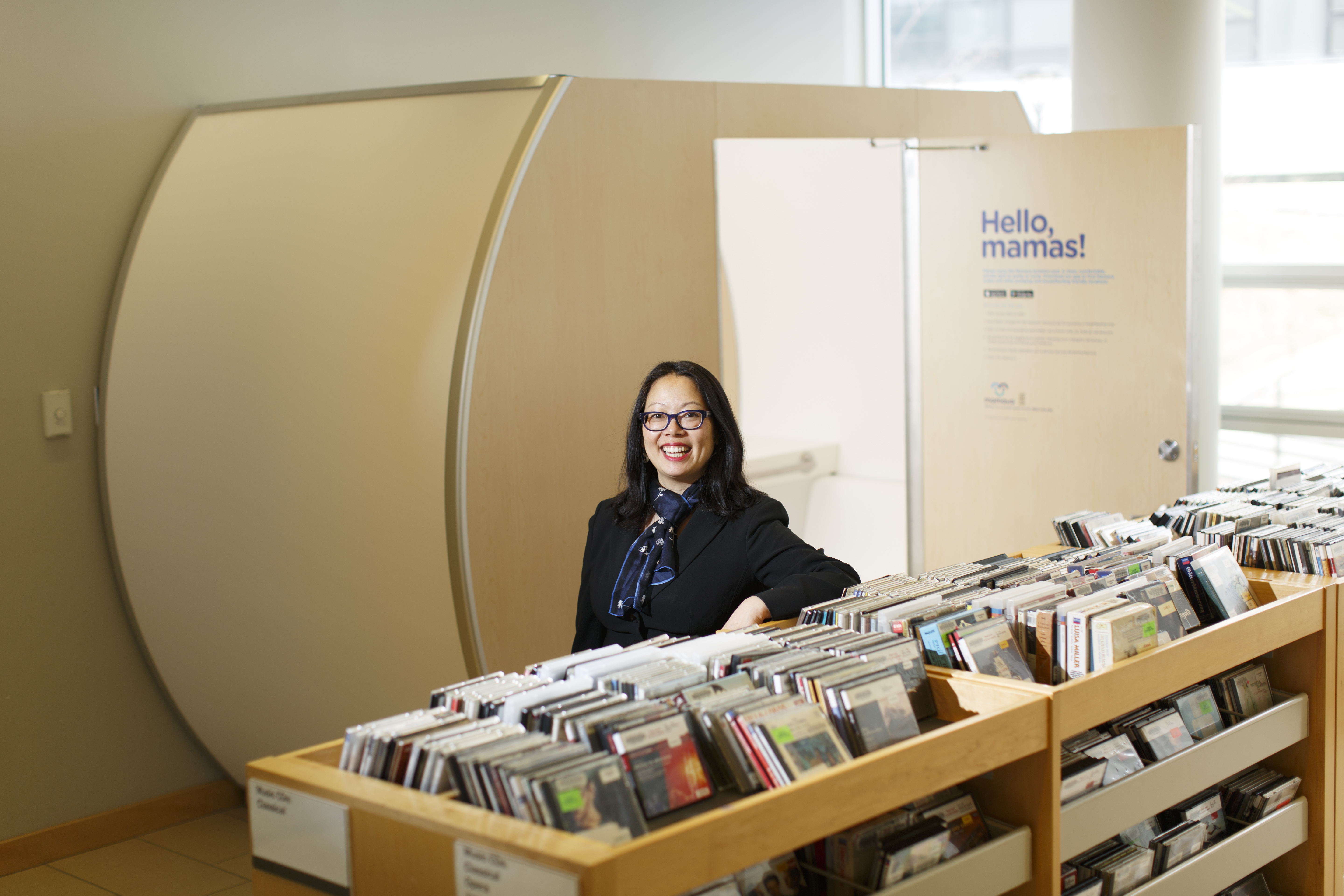 Cambridge Public Library director Maria McCauley, mother of a 9-month-old girl, stood near the library's Mamava lactation pod.
