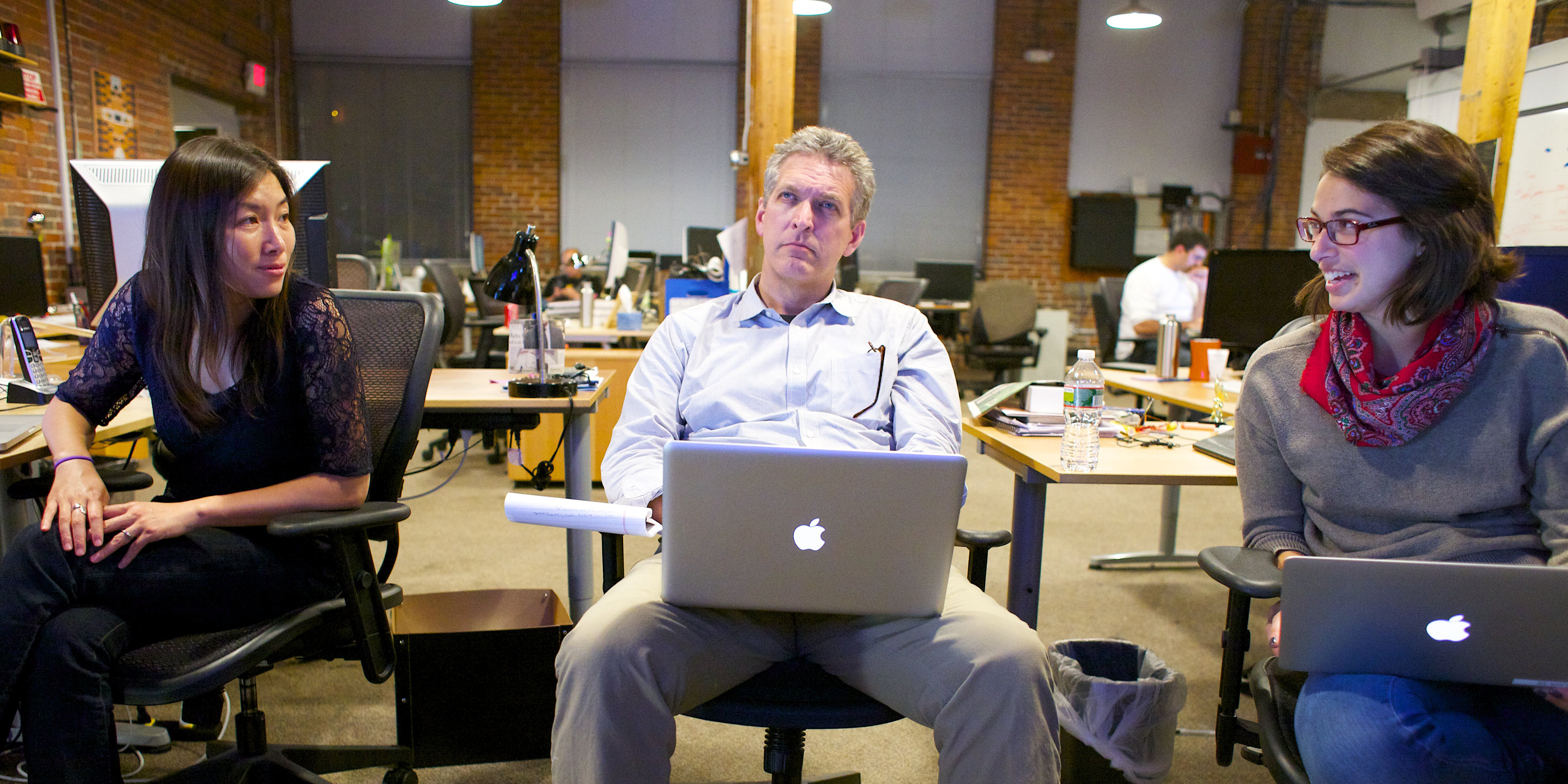 Bill Powers, who oversees Bluefin’s blog, The Crowdwire, watches a presidential debate with colleagues.