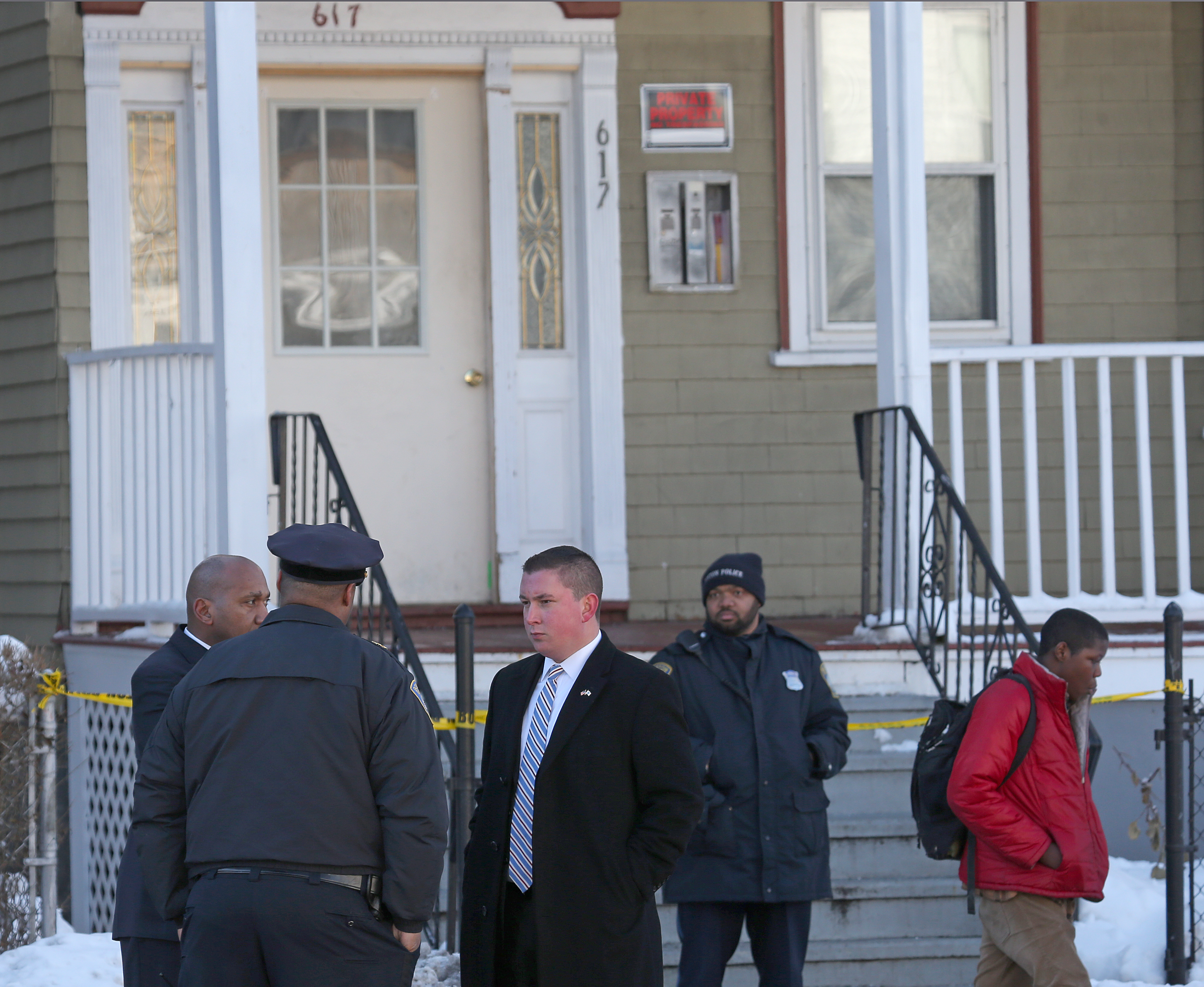Police investigating the fatal shooting of a Mattapan boy outside the Morton Street home where he was shot.