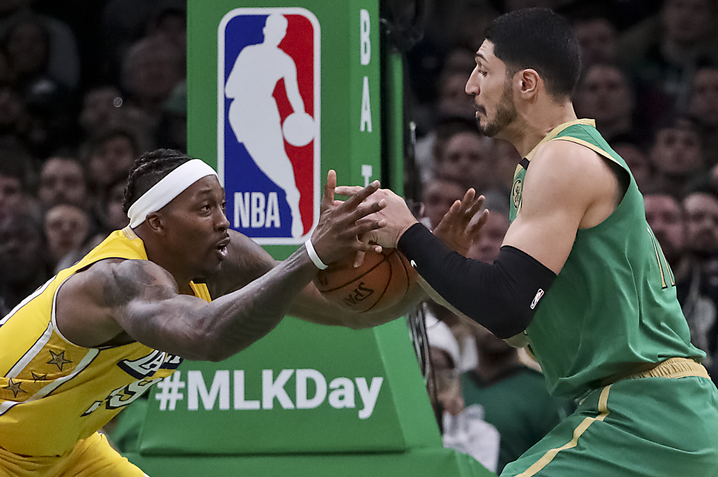 The Celtics’ Enes Kanter (right) battles with the Lakers’ Dwight Howard during the fourth quarter.