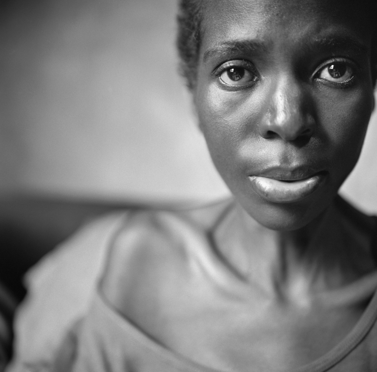 Kristen Ashburn’s untitled photograph of Maria Vindi, a former nurse in South Africa now living in Zimbabwe, and ill with HIV/AIDS, for which she cannot afford treatment.