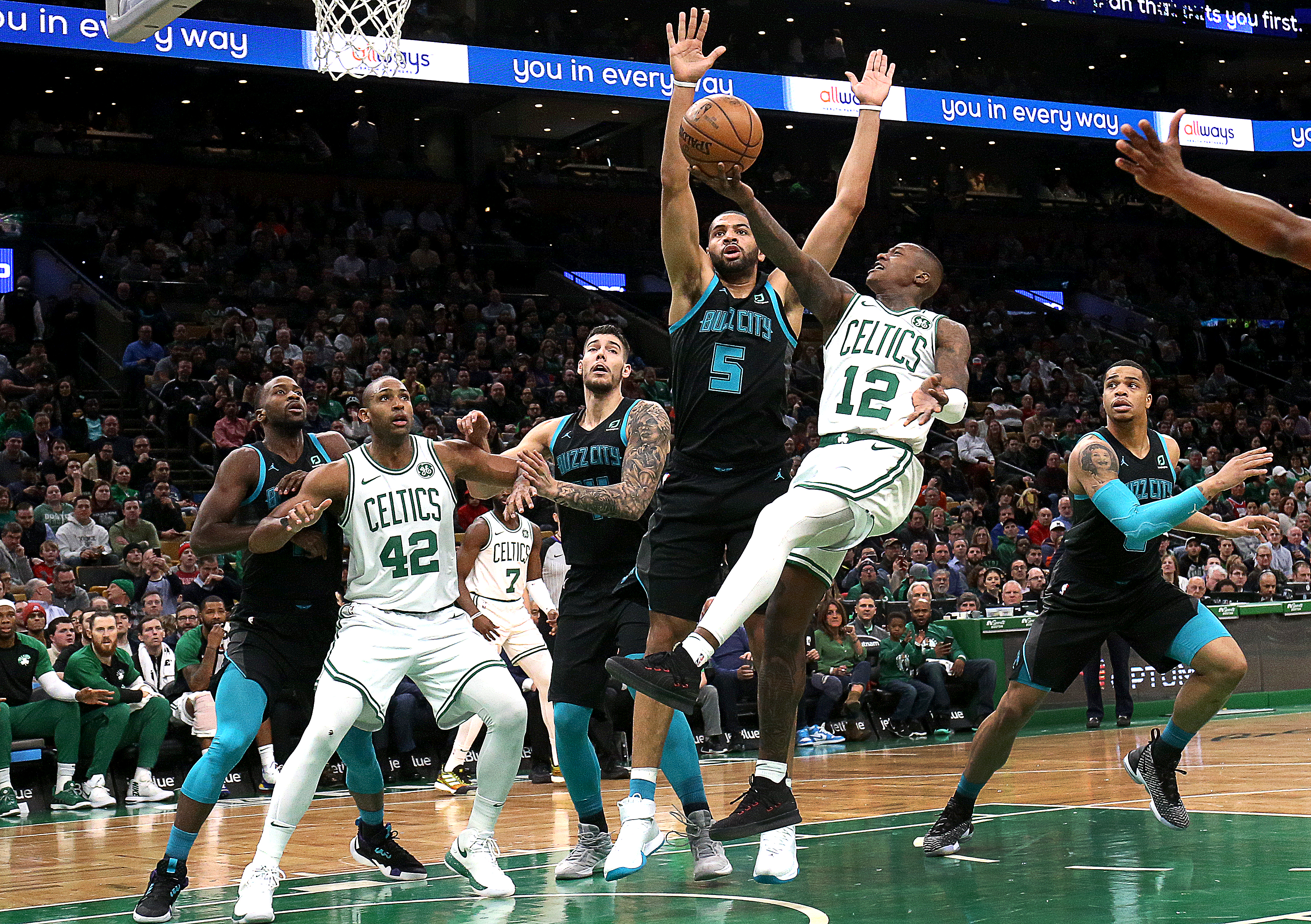 Terry Rozier draws a foul on the Hornets’ Nicolas Batum on a second-quarter drive to the basket.