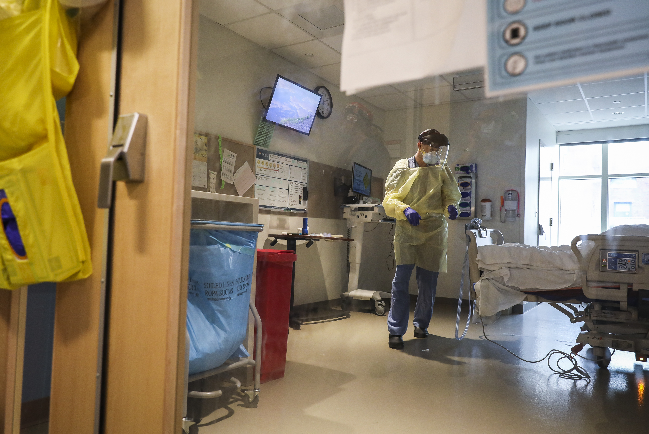 Dr. Samuel Belok, a pulmonary fellow, checked on a recently admitted COVID-19 patient in a Boston Medical Center ICU.