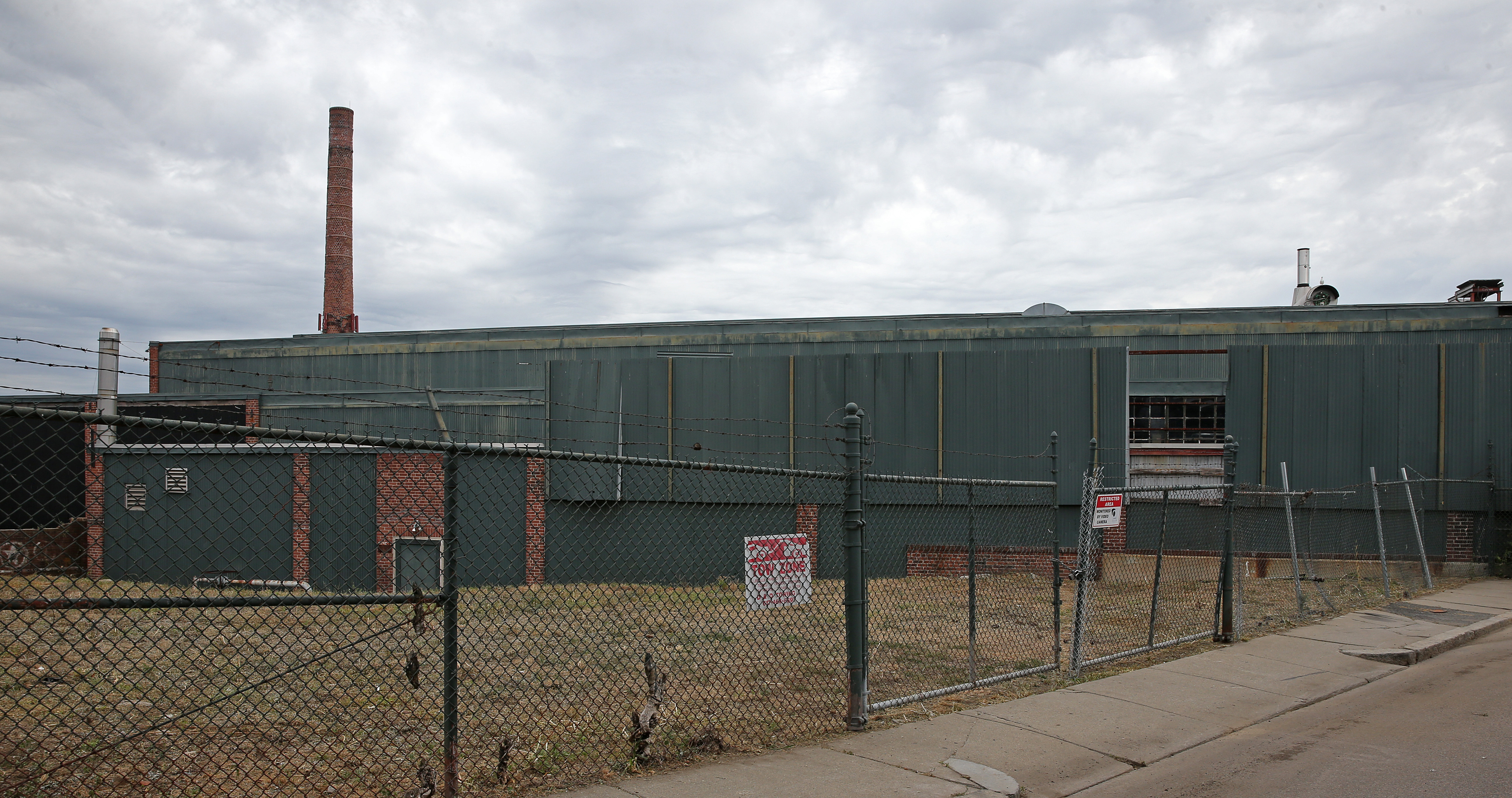 The plan would turn a block (above, the view from Tuckerman Street) of laundries and auto shops into a development with 656 units of housing.