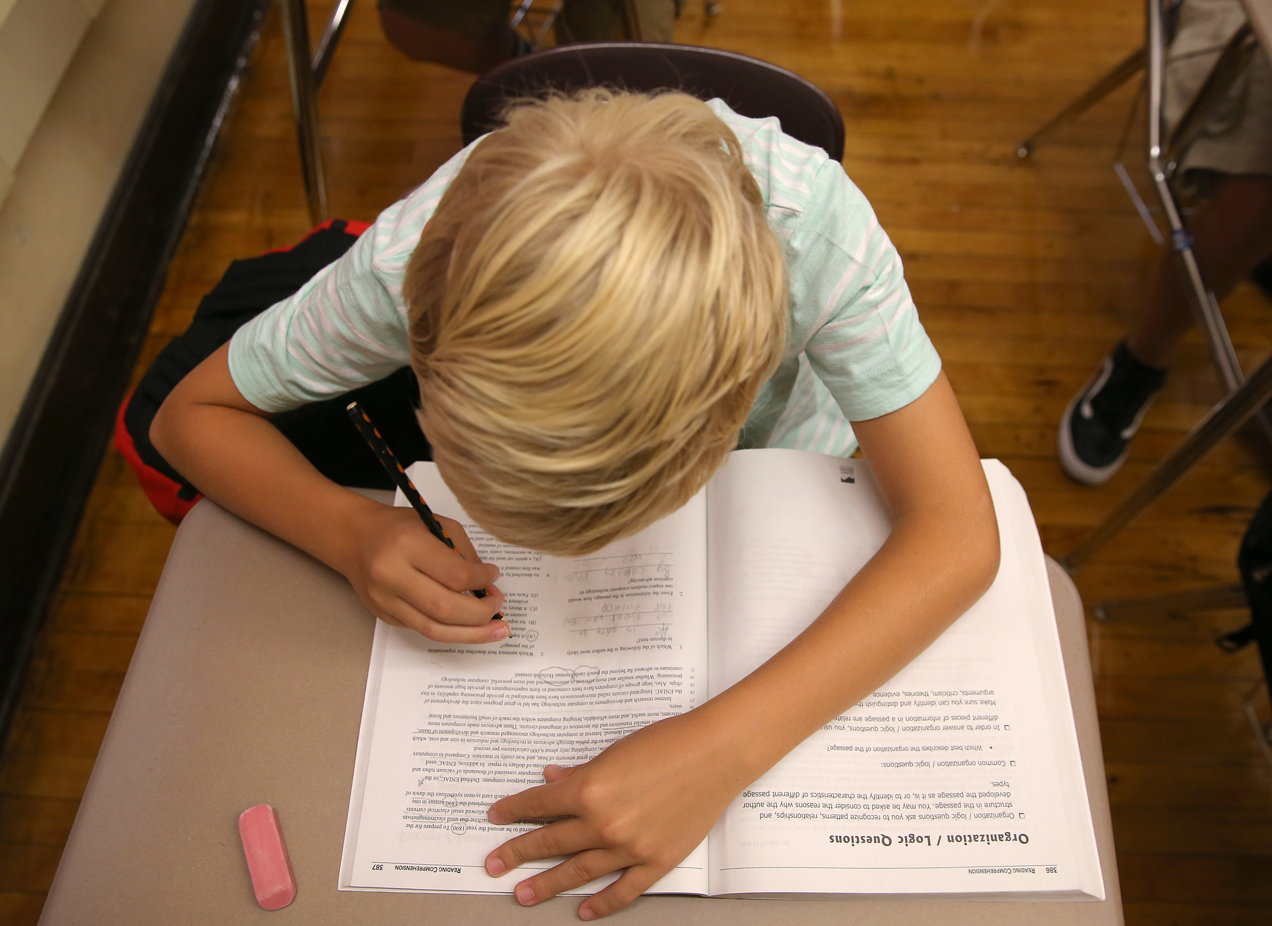Dennis Satchek, one of the students participating in the Exam School Initiative, worked on a test.