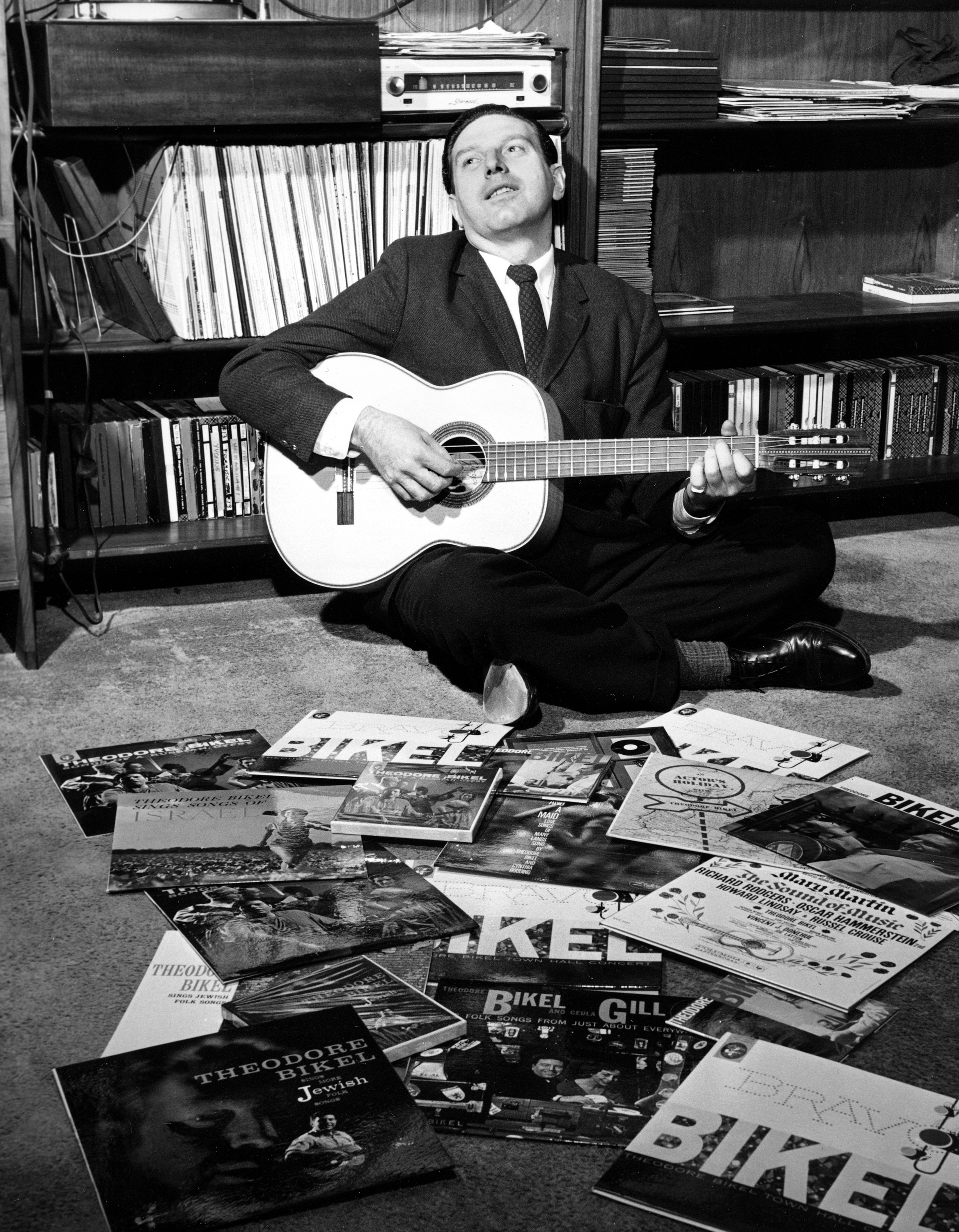 Theodore Bikel strummed his guitar on the floor of his Greenwich Village apartment in New York City, 1959.