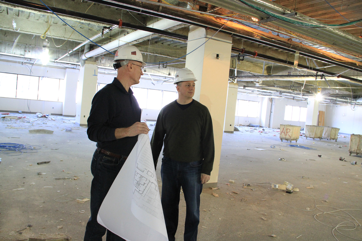 John Kucinski, Constant Contact’s senior facilities manager (left), and Andy Miller, its chief innovation architect, inspected the company’s expansion in Waltham, which will house startups as well as Constant Contact employees.