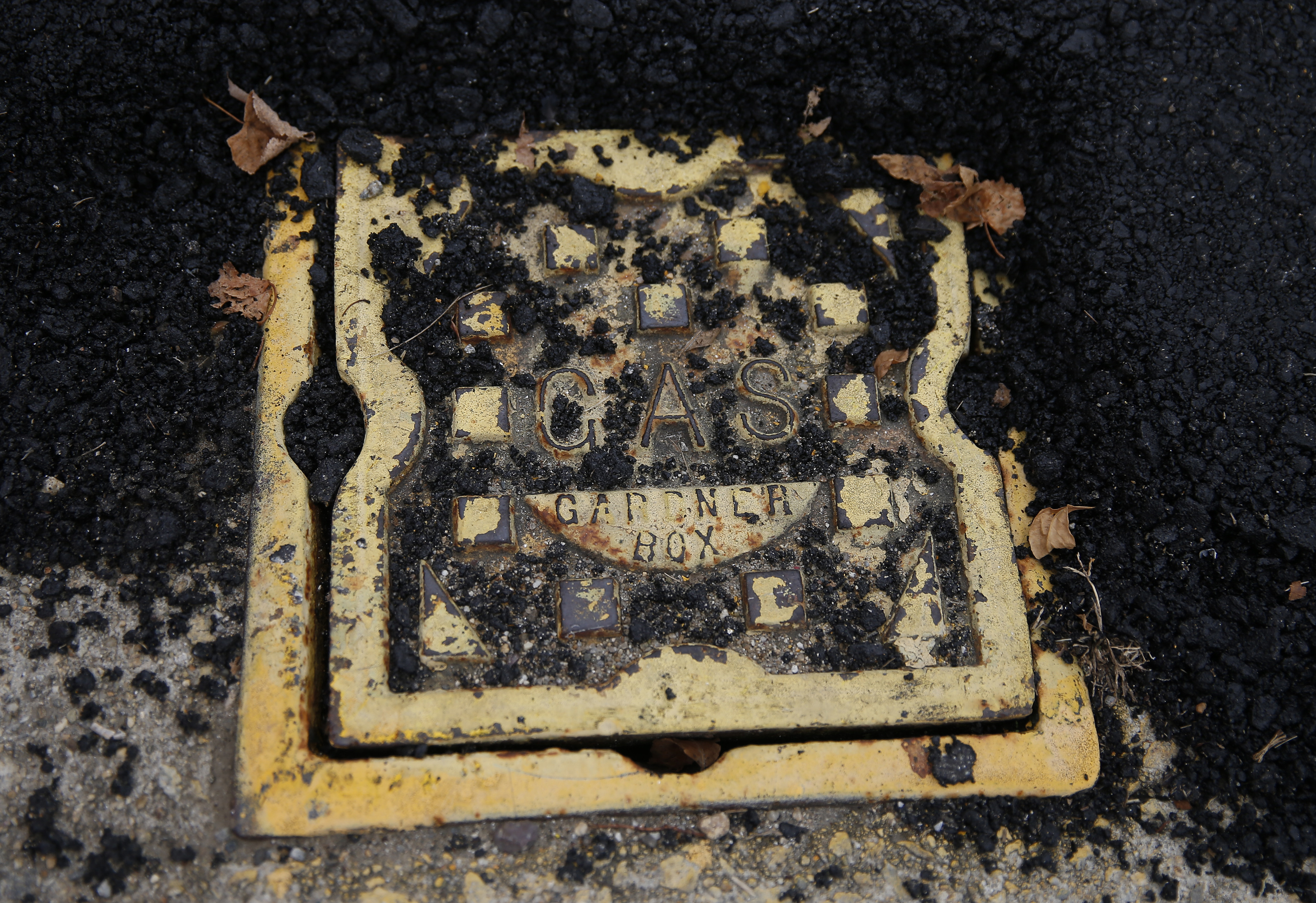 A Columbia Gas cover is seen on the sidewalk that runs along the left hand side of South Union Street, facing North, at the Winthrop Street intersection.