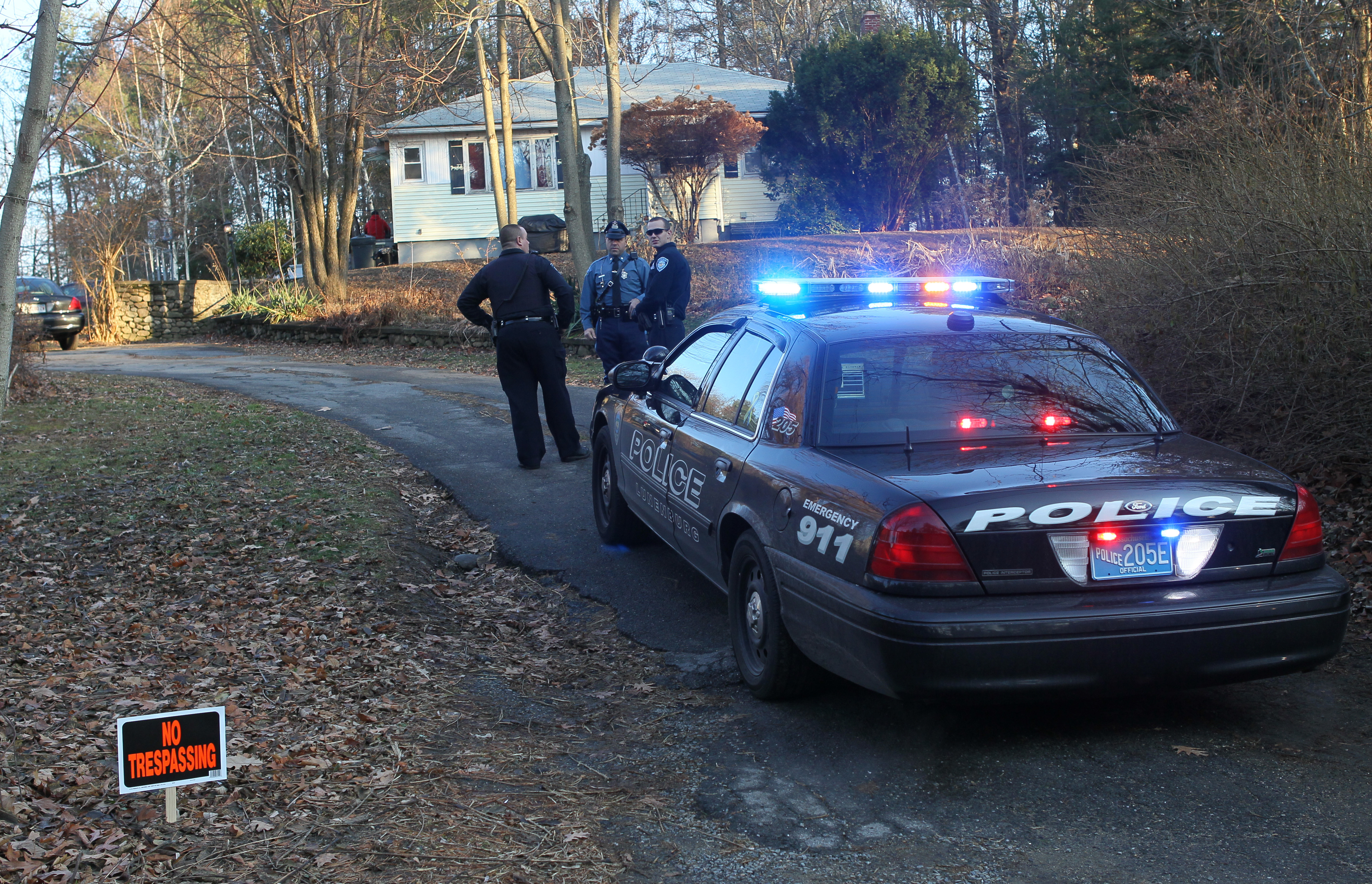 Police outside the Lunenburg home of the Phillips family as investigators were inside collecting evidence on Tuesday.