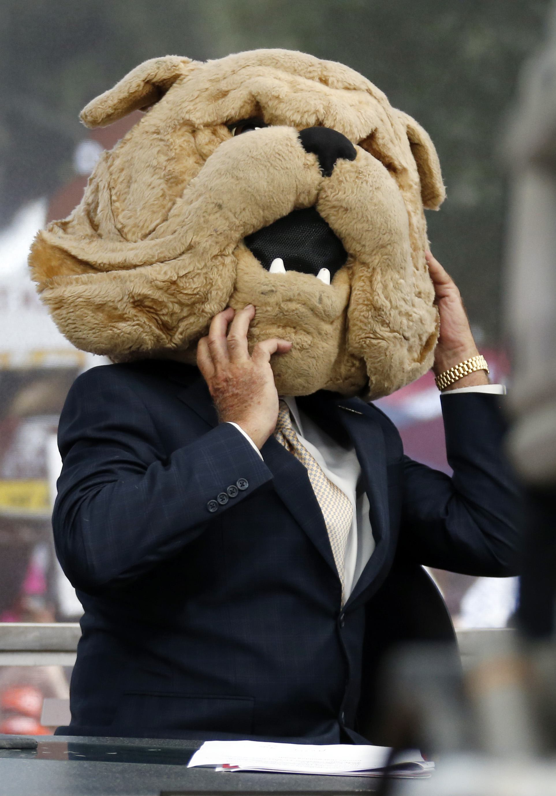 Lee Corso reveals his pick at the site of “College GameDay” by donning the headpiece of the mascot of the school he believes will wins.