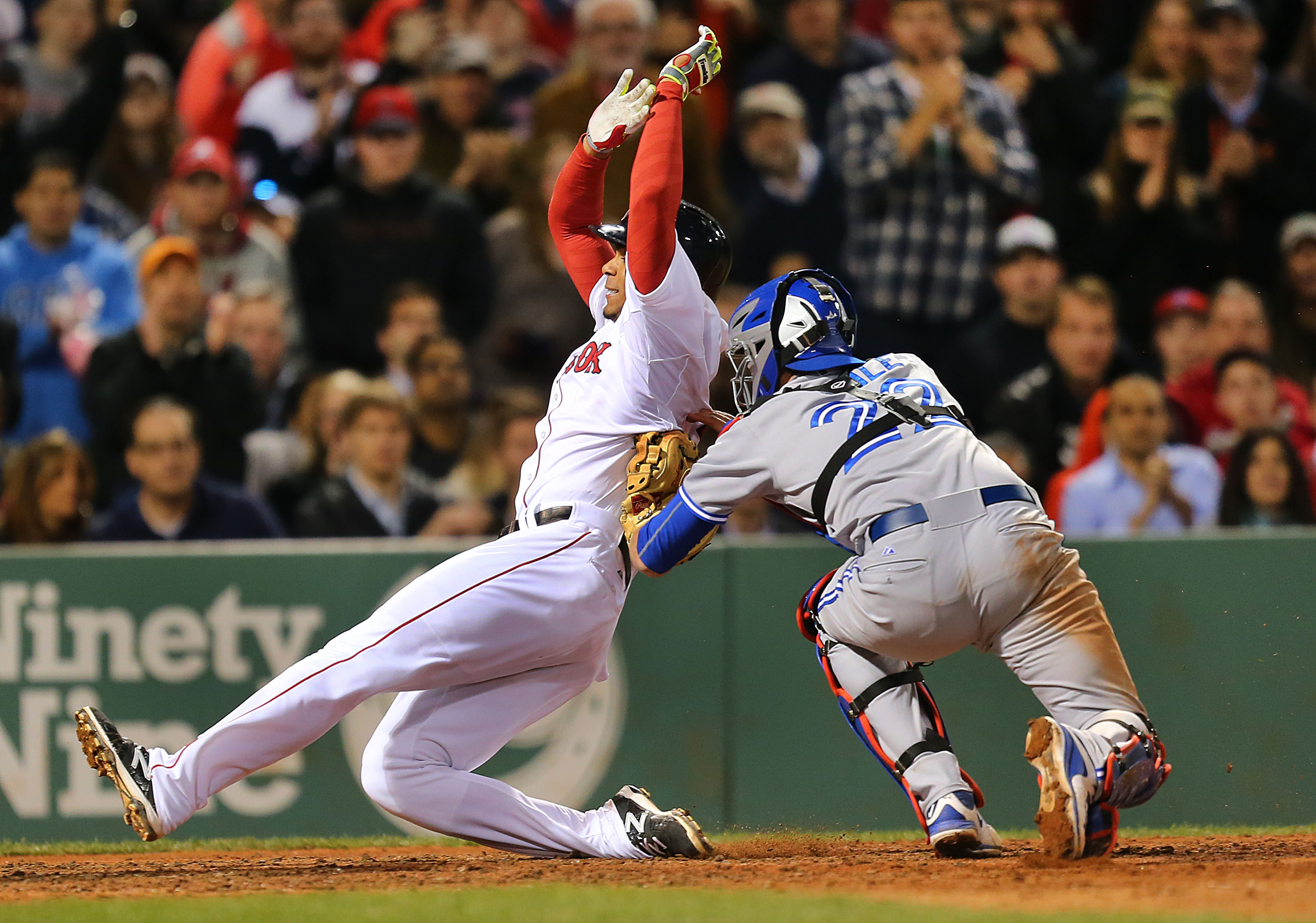 Shortstop Xander Bogaerts unsuccessfully tried to avoid Josh Thole’s tag at the plate in the seventh inning.
