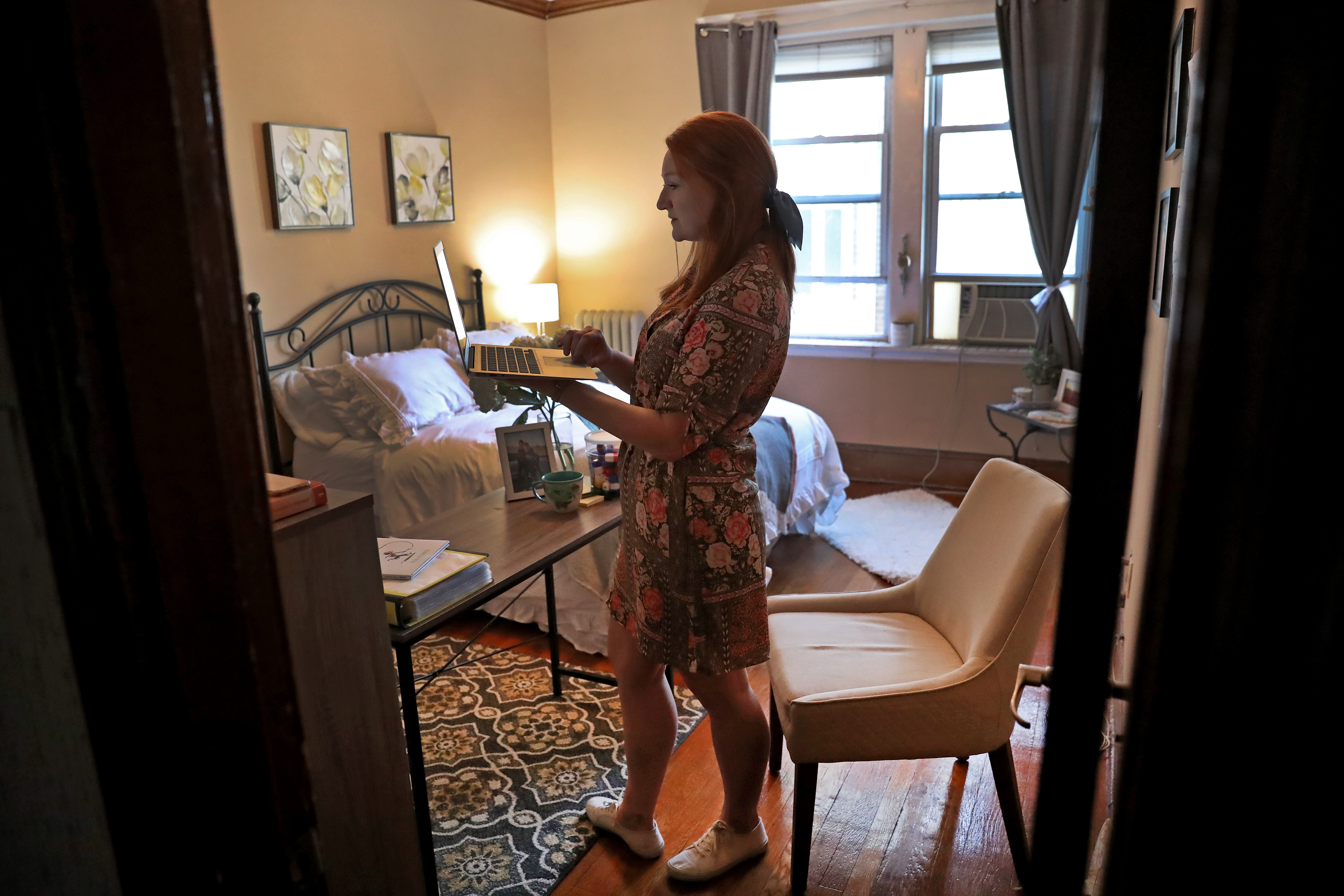 Lyons spoke to her first-grade classroom from her apartment.