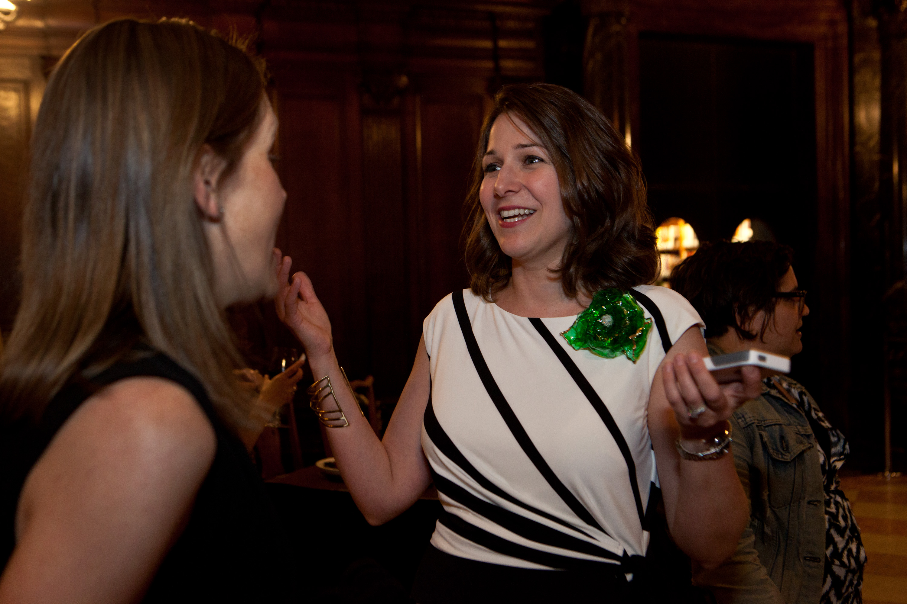 Author Elaine Dimopoulos greets Erin Galloway at the BPL party.