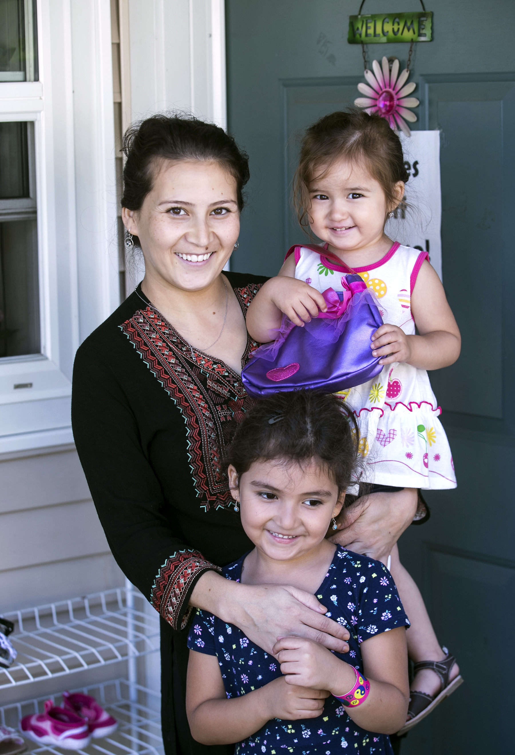 Safiya Wazir and her daughters Aaliyah, 2, and Mahwash outside their home in Concord, N.H.